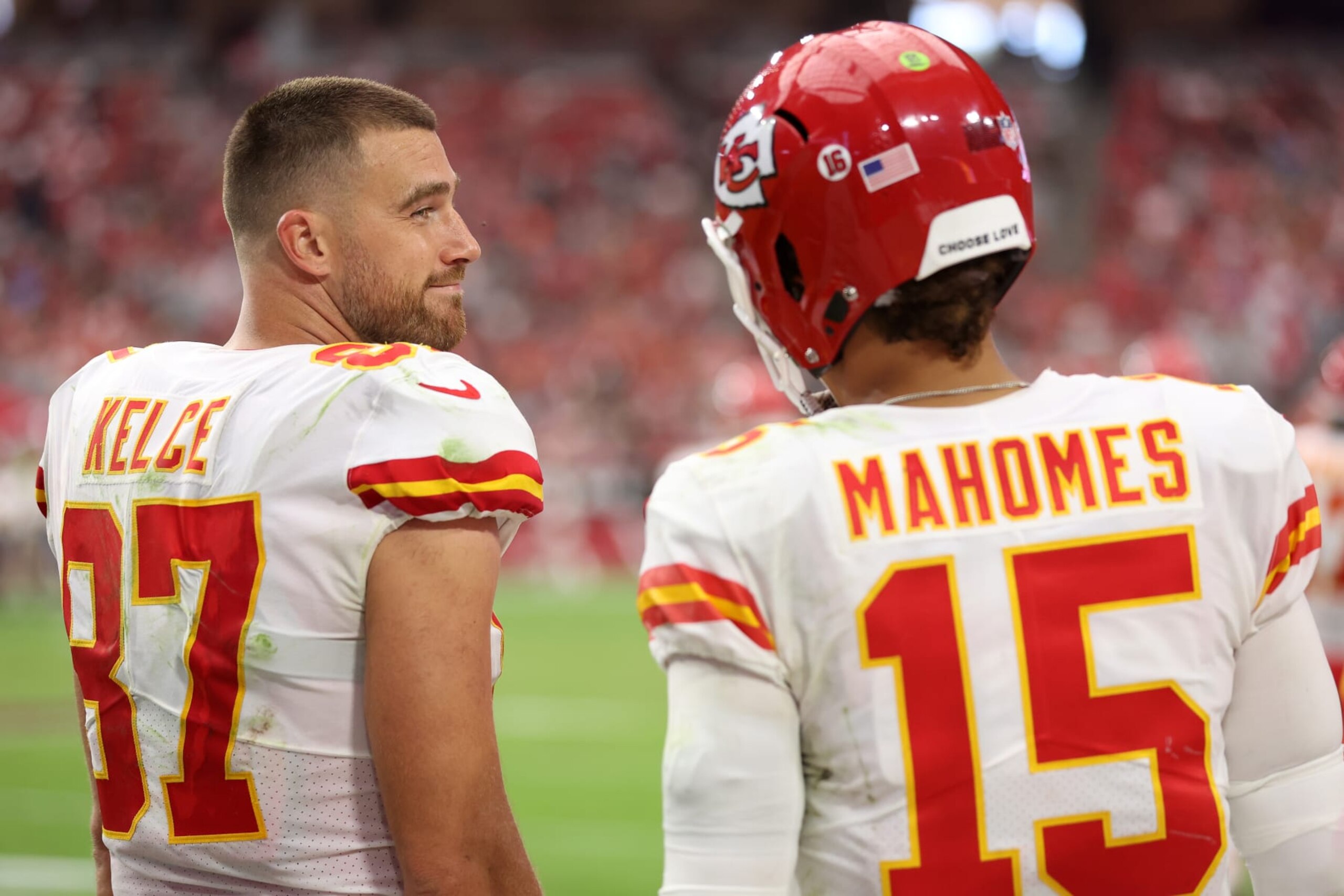 GLENDALE, ARIZONA - SEPTEMBER 11: Tight end Travis Kelce #87 looks over at quarterback Patrick Mahomes #15 of the Kansas City Chiefs during the game against the Arizona Cardinals at State Farm Stadium on September 11, 2022 in Glendale, Arizona. (Photo by Christian Petersen/Getty Images)