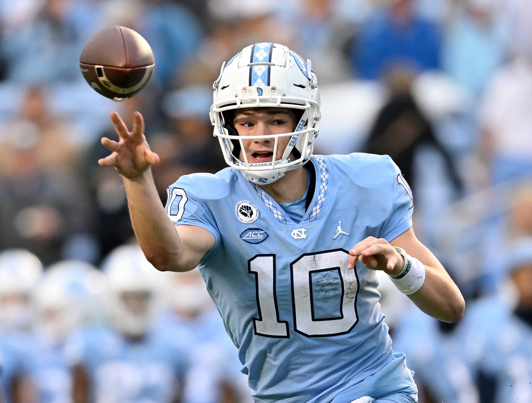 CHAPEL HILL, NORTH CAROLINA - OCTOBER 01: Drake Maye #10 of the North Carolina Tar Heels throws a shot pass against the Virginia Tech Hokies during the second half of their game at Kenan Memorial Stadium on October 01, 2022 in Chapel Hill, North Carolina. (Photo by Grant Halverson/Getty Images)