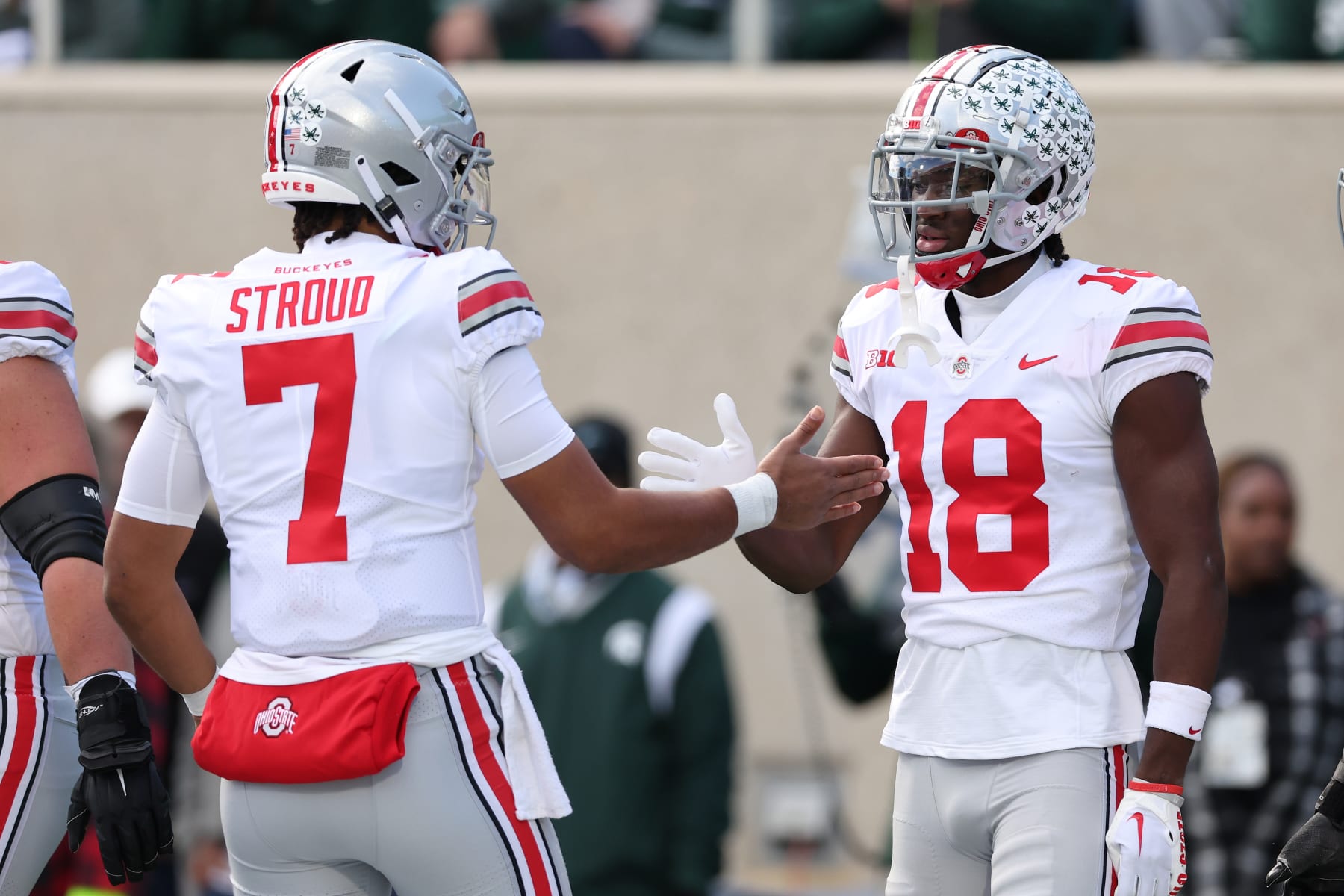 EAST LANSING, MICHIGAN - OCTOBER 08: Marvin Harrison Jr. #18 of the Ohio State Buckeyes celebrates a first half touchdown with C.J. Stroud #7 while playing the Michigan State Spartans at Spartan Stadium on October 08, 2022 in East Lansing, Michigan. (Photo by Gregory Shamus/Getty Images)