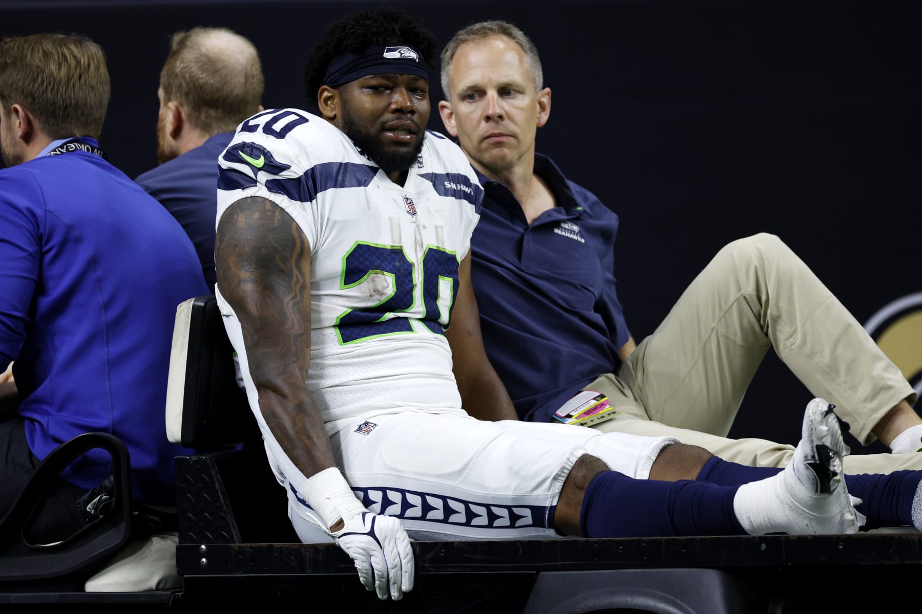 NEW ORLEANS, LOUISIANA - OCTOBER 09: Rashaad Penny #20 of the Seattle Seahawks is carted off the field after being injured during the third quarter against the New Orleans Saints at Caesars Superdome on October 09, 2022 in New Orleans, Louisiana. (Photo by Chris Graythen/Getty Images)