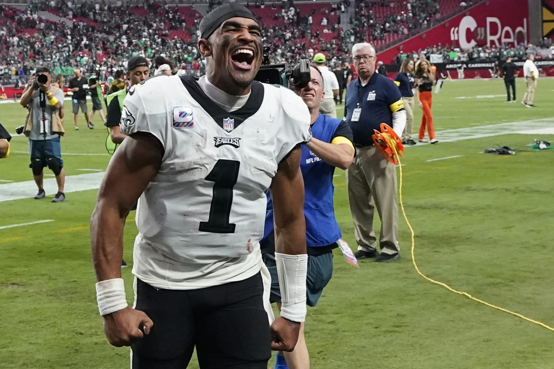 Philadelphia Eagles quarterback Jalen Hurts (1) celebrates after defeating the Arizona Cardinals in an NFL football game, Sunday, Oct. 9, 2022, in Glendale, Ariz. (AP Photo/Ross D. Franklin)
