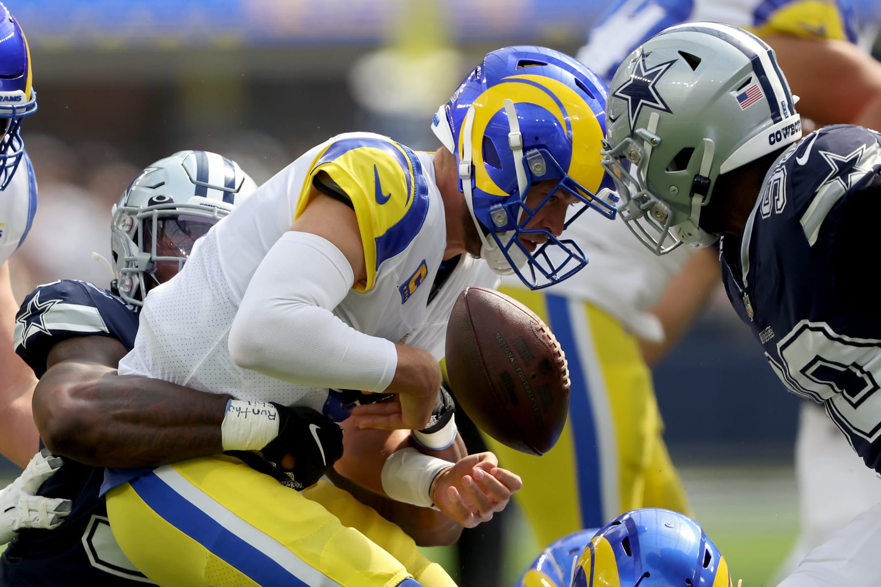 INGLEWOOD, CALIFORNIA - OCTOBER 09: Quinton Bohanna #98 of the Dallas Cowboys forces a fumble on Matthew Stafford #9 of the Los Angeles Rams during the first quarter at SoFi Stadium on October 09, 2022 in Inglewood, California. (Photo by Sean M. Haffey/Getty Images)