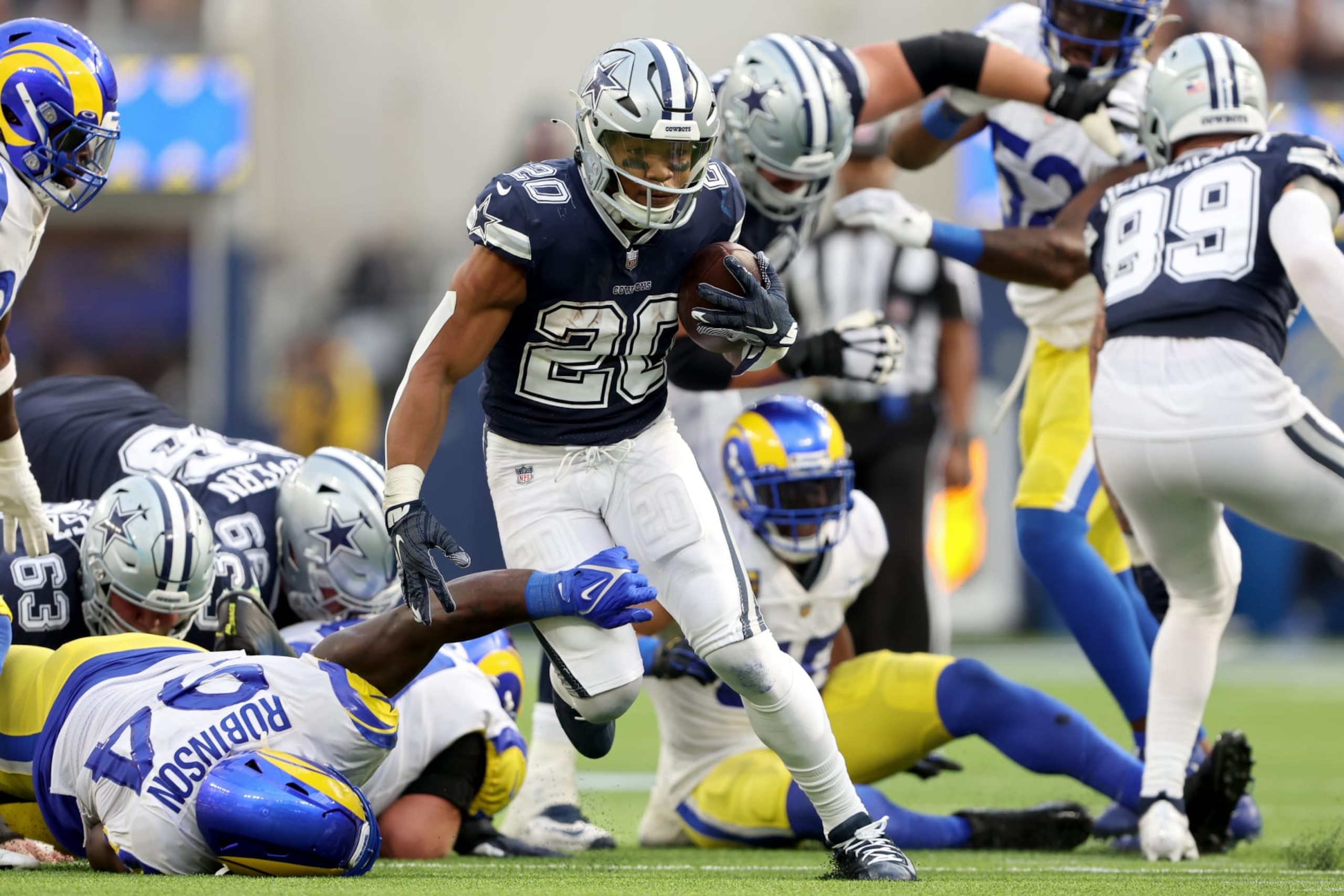 INGLEWOOD, CALIFORNIA - OCTOBER 09: Tony Pollard #20 of the Dallas Cowboys runs against the Los Angeles Rams during the fourth quarter at SoFi Stadium on October 09, 2022 in Inglewood, California. (Photo by Sean M. Haffey/Getty Images)