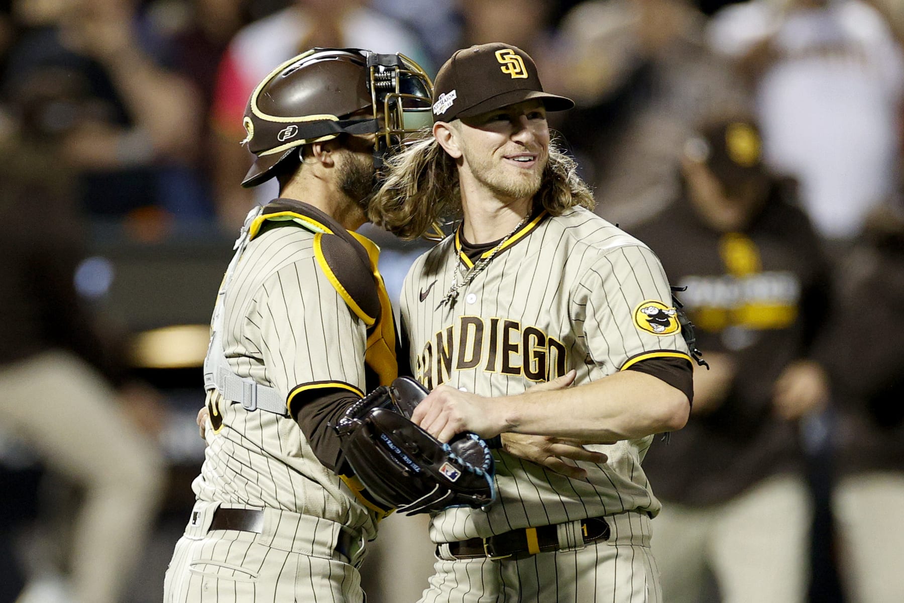 NEW YORK, NEW YORK - OCTOBER 09: Josh Hader #71 of the San Diego Padres celebrates with Austin Nola #26 after defeating the New York Mets in game three to win the National League Wild Card Series at Citi Field on October 09, 2022 in the Flushing neighborhood of the Queens borough of New York City. The San Diego Padres defeated the New York Mets with a score of 6 to 0. (Photo by Sarah Stier/Getty Images)