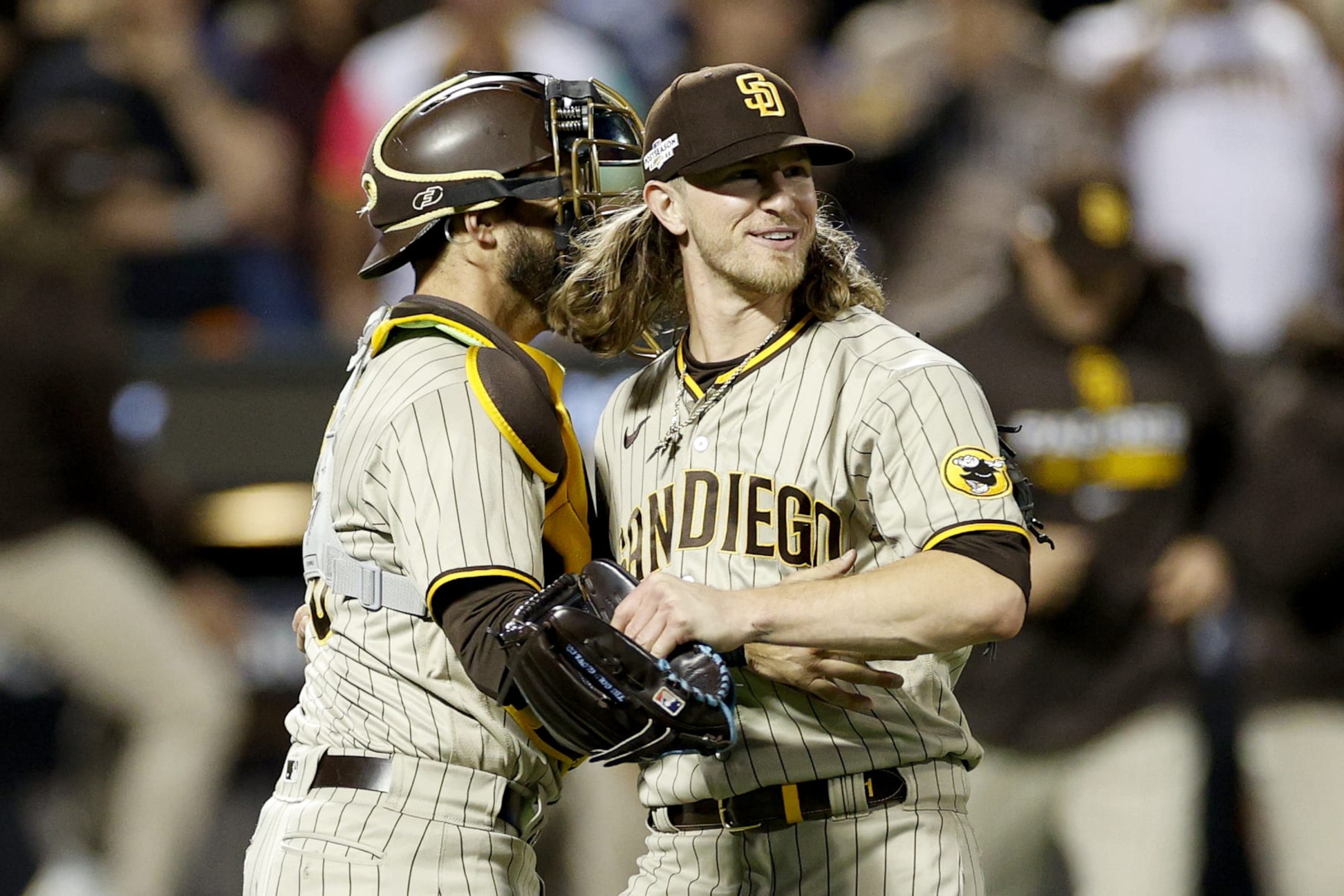 NEW YORK, NEW YORK - OCTOBER 09: Josh Hader #71 of the San Diego Padres celebrates with Austin Nola #26 after defeating the New York Mets in game three to win the National League Wild Card Series at Citi Field on October 09, 2022 in the Flushing neighborhood of the Queens borough of New York City. The San Diego Padres defeated the New York Mets with a score of 6 to 0. (Photo by Sarah Stier/Getty Images)