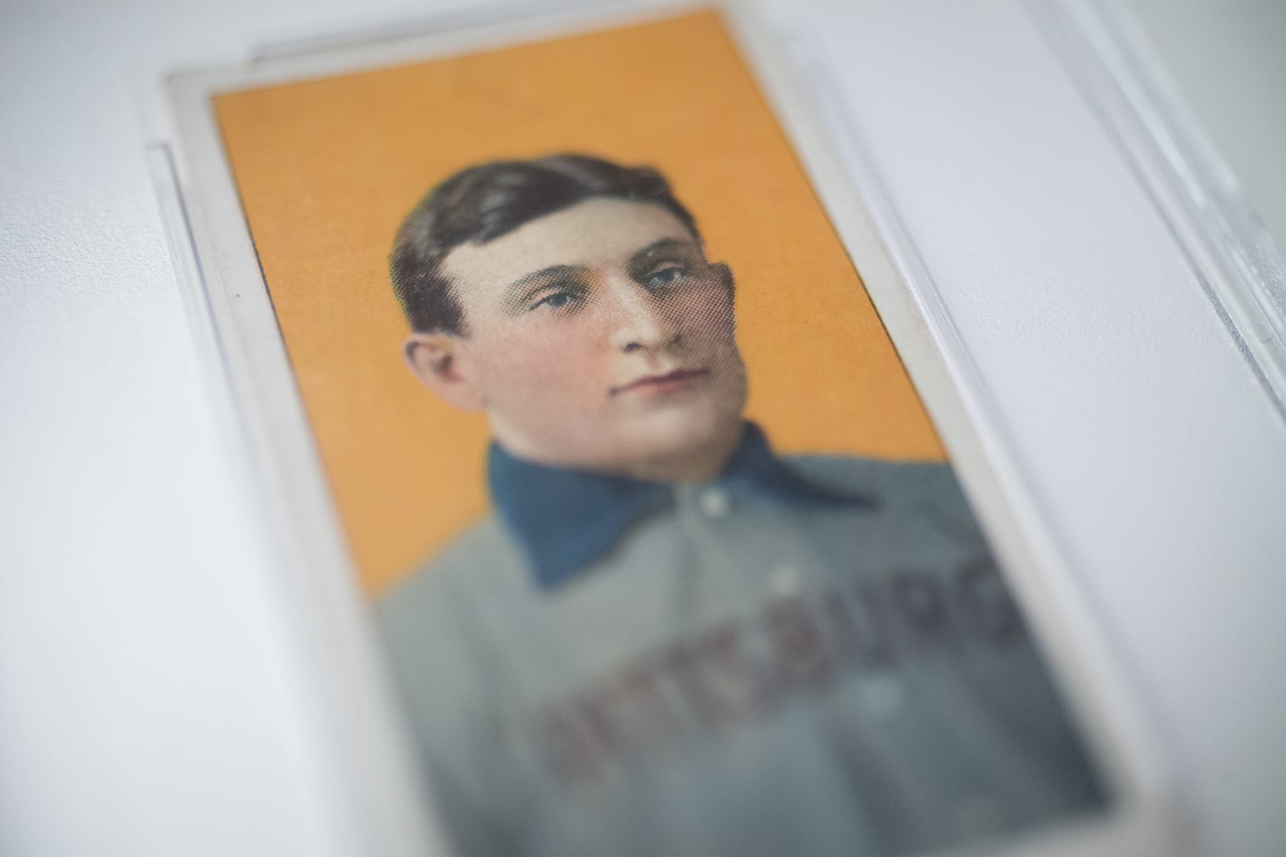 The 1909 baseball card of Pittsburgh Pirates shortstop Honus Wagner is displayed for a photograph in New York, U.S., on Tuesday, Feb. 19, 2013. The trading card that the National Baseball Hall of Fame calls the sport's "most famous collectible" will be up for sale starting Feb. 25,  and might fetch more than $2.8 million, according to the auction house. Photographer: Scott Eells/Bloomberg via Getty Images