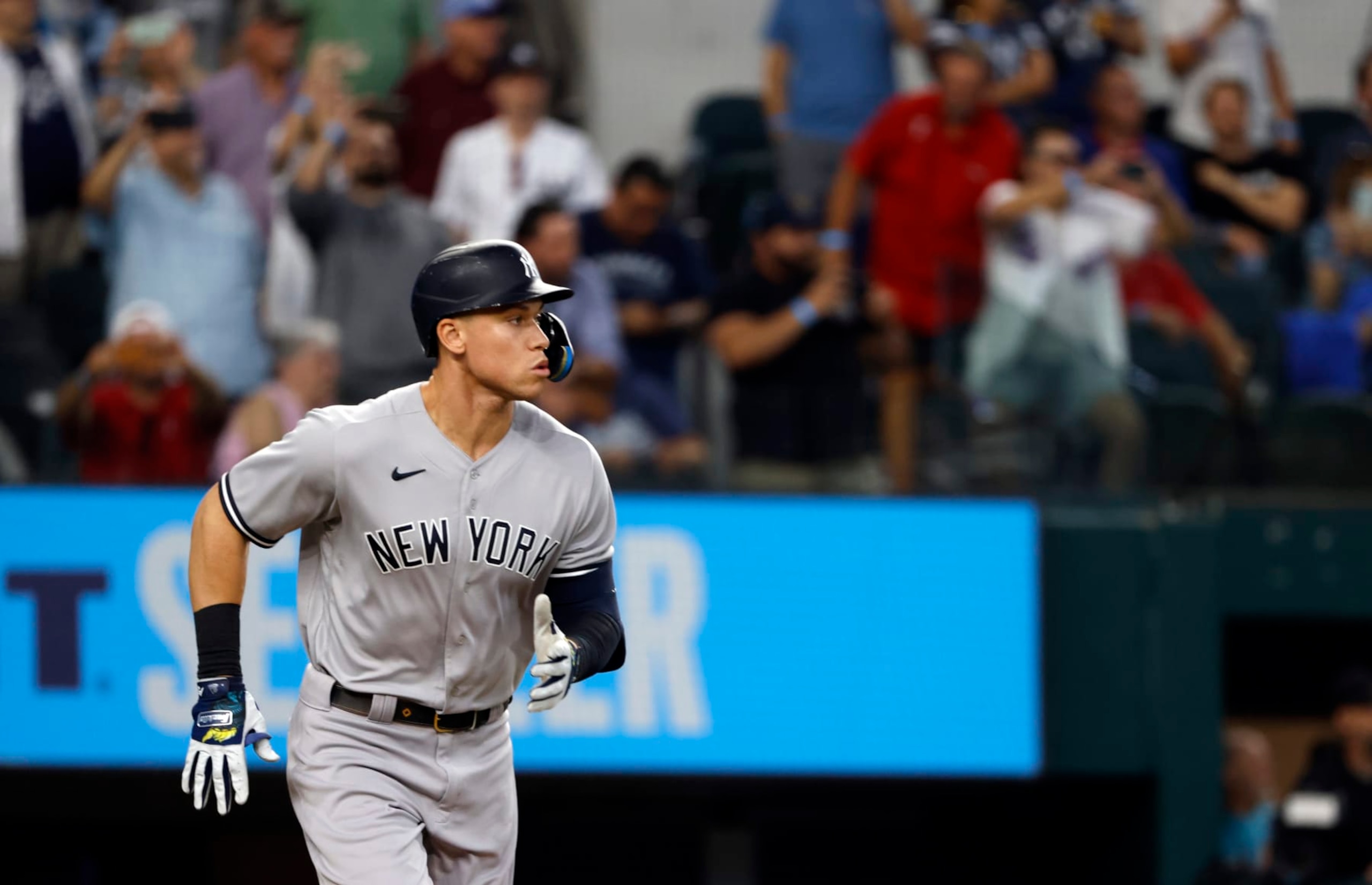 ARLINGTON, TX - OCTOBER 4: Aaron Judge #99 of the New York Yankees runs to first base against the Texas Rangers in game one of a double header at Globe Life Field on October 4, 2022 in Arlington, Texas. (Photo by Ron Jenkins/Getty Images)