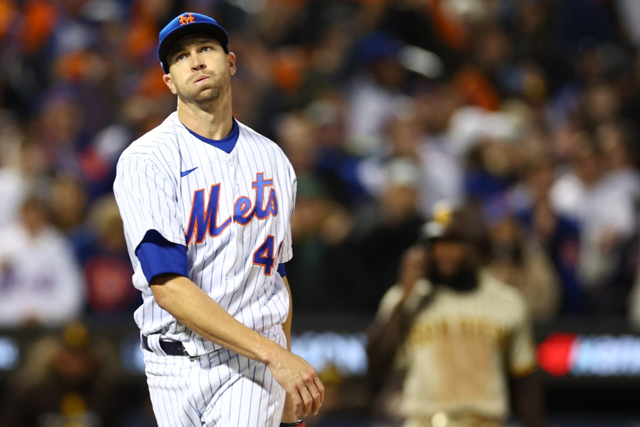 NEW YORK, NEW YORK - OCTOBER 08: Jacob deGrom #48 of the New York Mets reacts to striking out Manny Machado #13 of the San Diego Padres to get out of the third inning in game two of the Wild Card Series at Citi Field on October 08, 2022 in New York City. (Photo by Elsa/Getty Images)