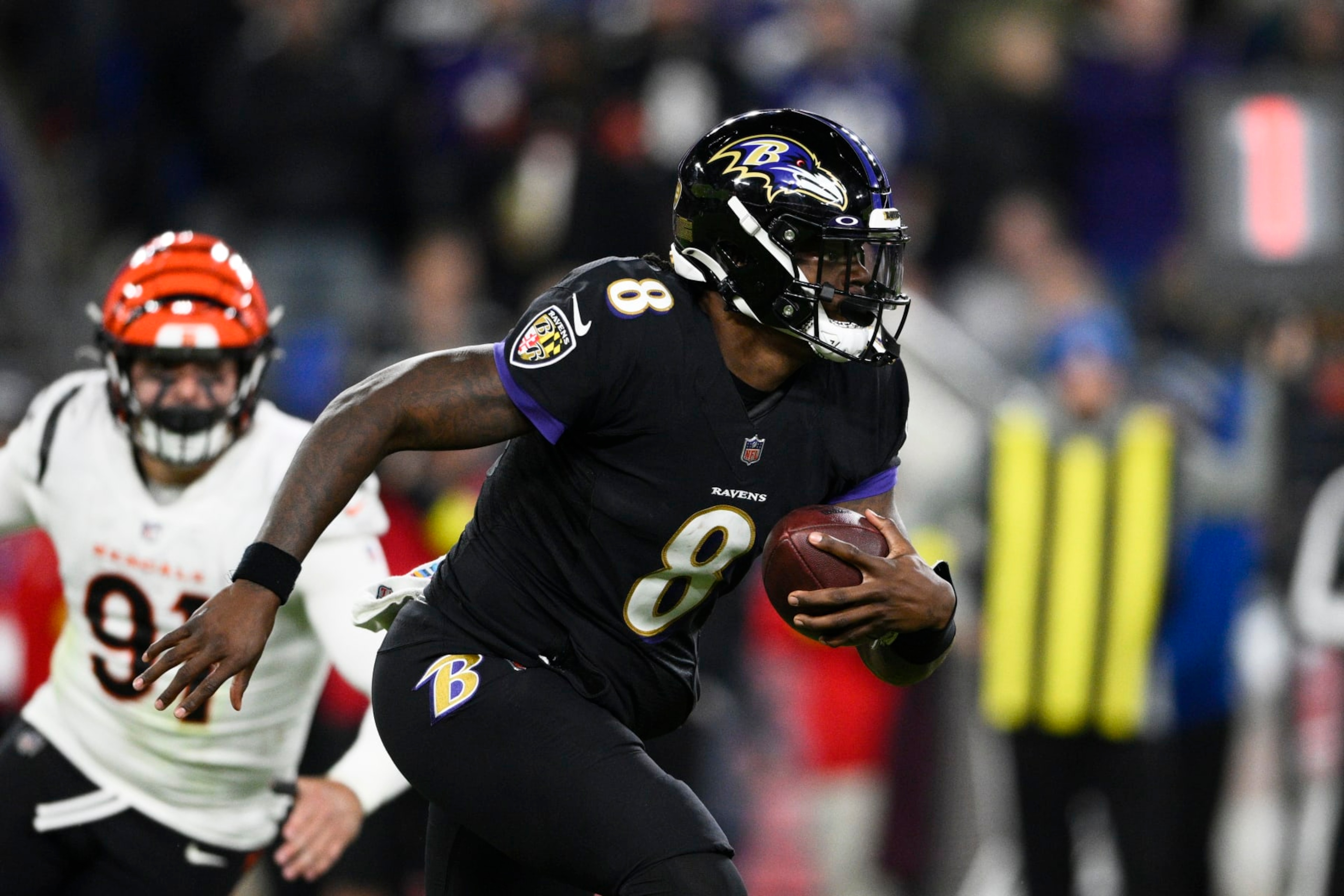 Baltimore Ravens quarterback Lamar Jackson carries the ball during the second half of an NFL football game against the Cincinnati Bengals, Sunday, Oct. 9, 2022, in Baltimore. (AP Photo/Nick Wass)