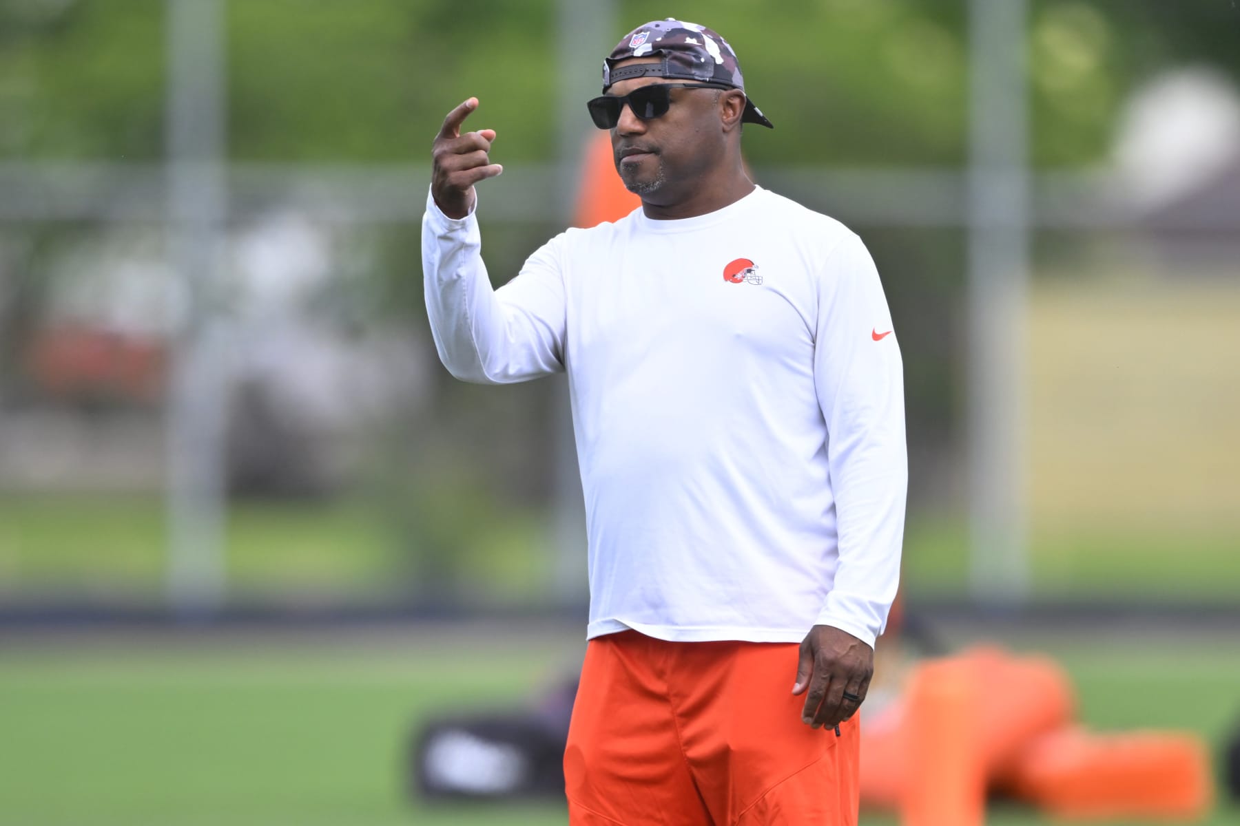 Cleveland Browns defensive coordinator Joe Woods stands on the field during an NFL football practice at the team's training facility Wednesday, June 8, 2022, in Berea, Ohio. (AP Photo/David Richard)