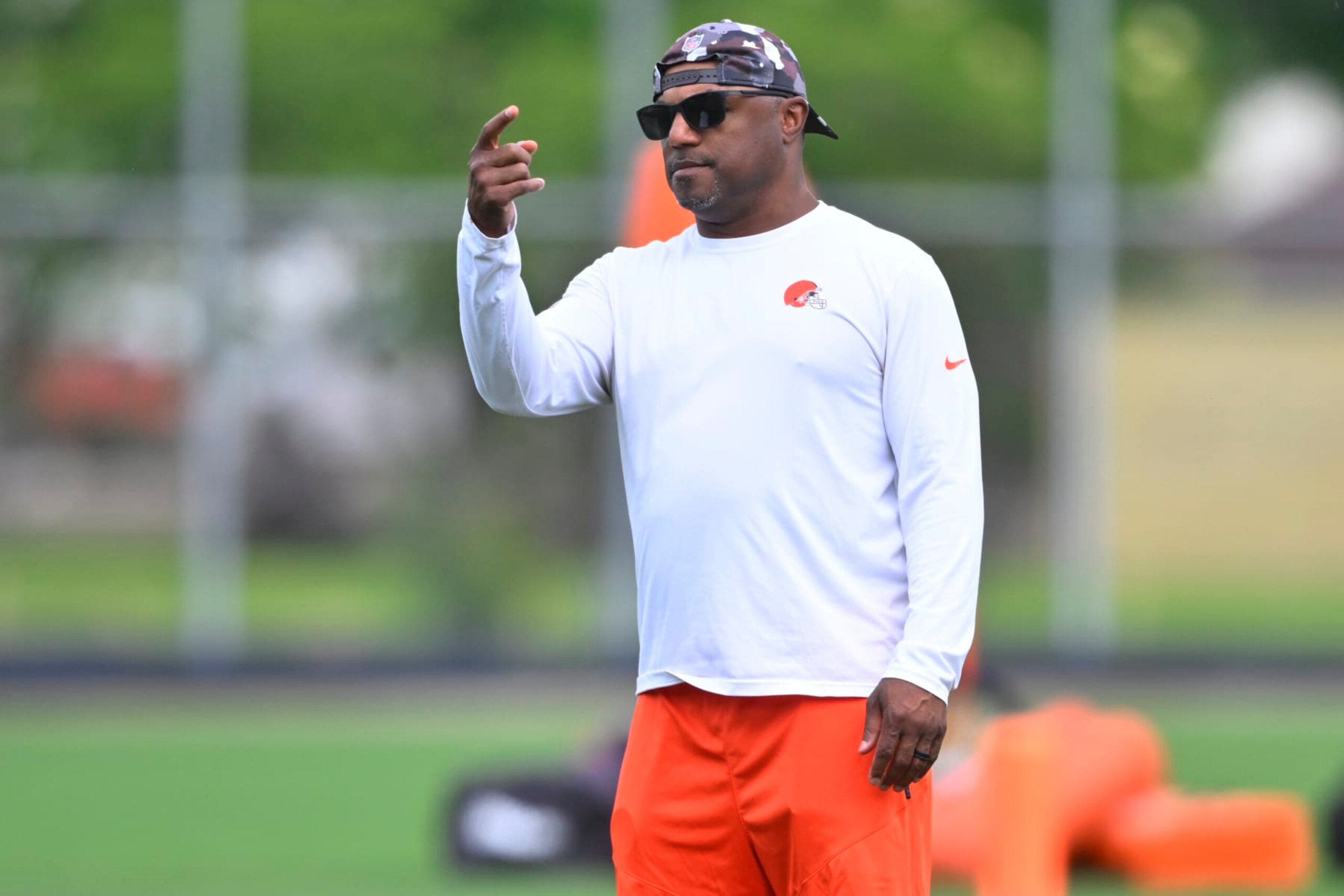 Cleveland Browns defensive coordinator Joe Woods stands on the field during an NFL football practice at the team's training facility Wednesday, June 8, 2022, in Berea, Ohio. (AP Photo/David Richard)