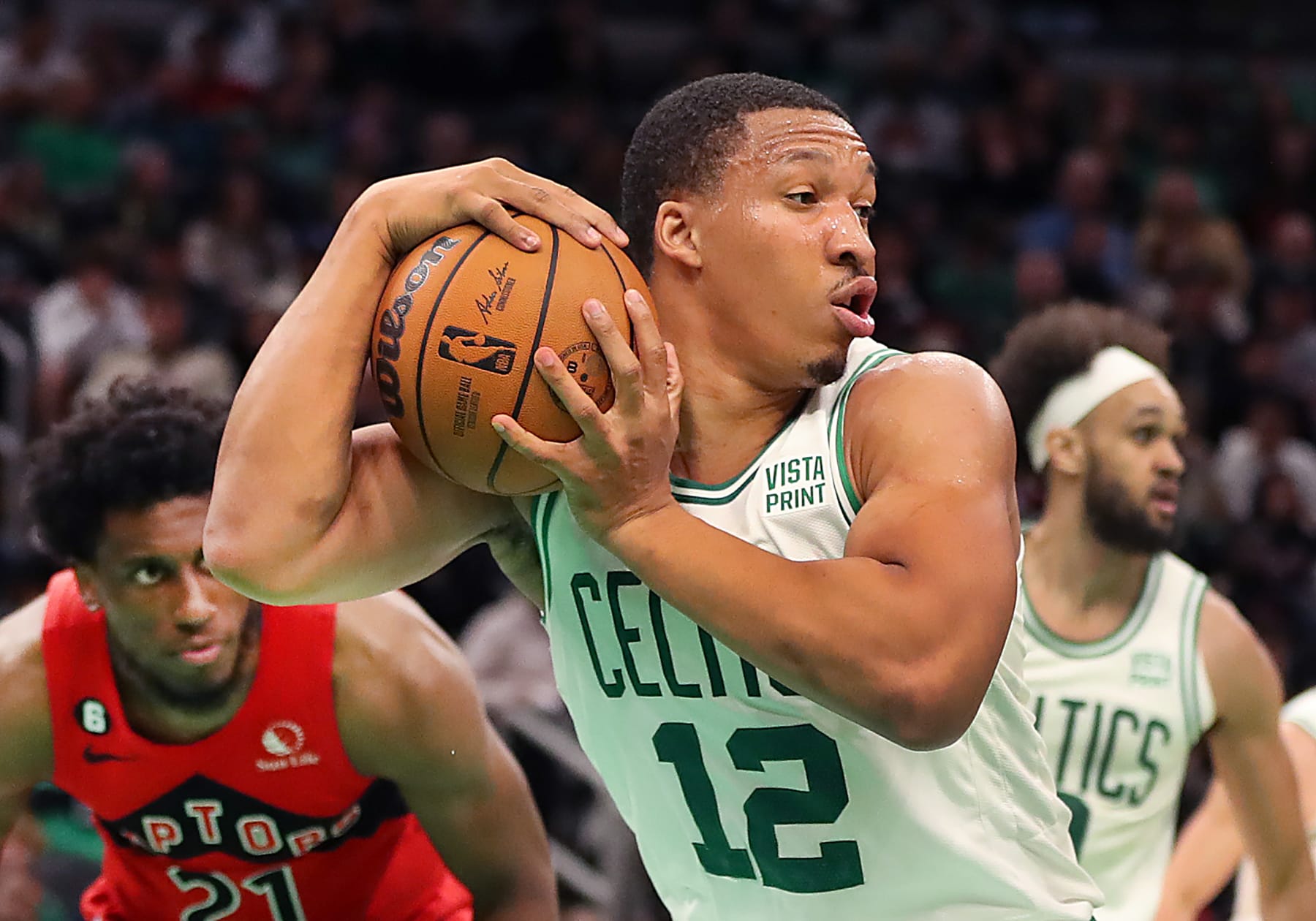 Boston, MA - October 5: Boston Celtics PF Grant Williams pulls down a 3rd quarter rebound. The Celtics lost to the Toronto Raptors, 125-119. (Photo by John Tlumacki/The Boston Globe via Getty Images)