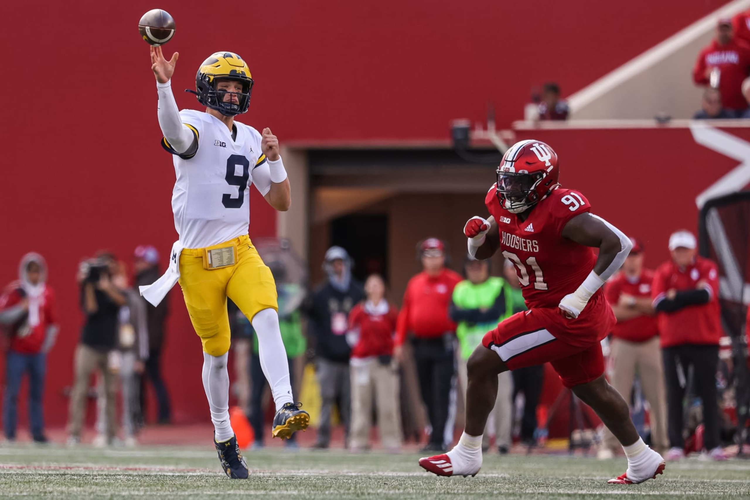 BLOOMINGTON, IN - OCTOBER 08: J.J. McCarthy #9 of the Michigan Wolverines drops back to throw during the game against the Indiana Hoosiers at Memorial Stadium on October 8, 2022 in Bloomington, Indiana. (Photo by Michael Hickey/Getty Images) BLOOMINGTON, IN - OCTOBER 08: J.J. McCarthy #9 of the Michigan Wolverines drops back to throw during the game against the Indiana Hoosiers at Memorial Stadium on October 8, 2022 in Bloomington, Indiana. (Photo by Michael Hickey/Getty Images)