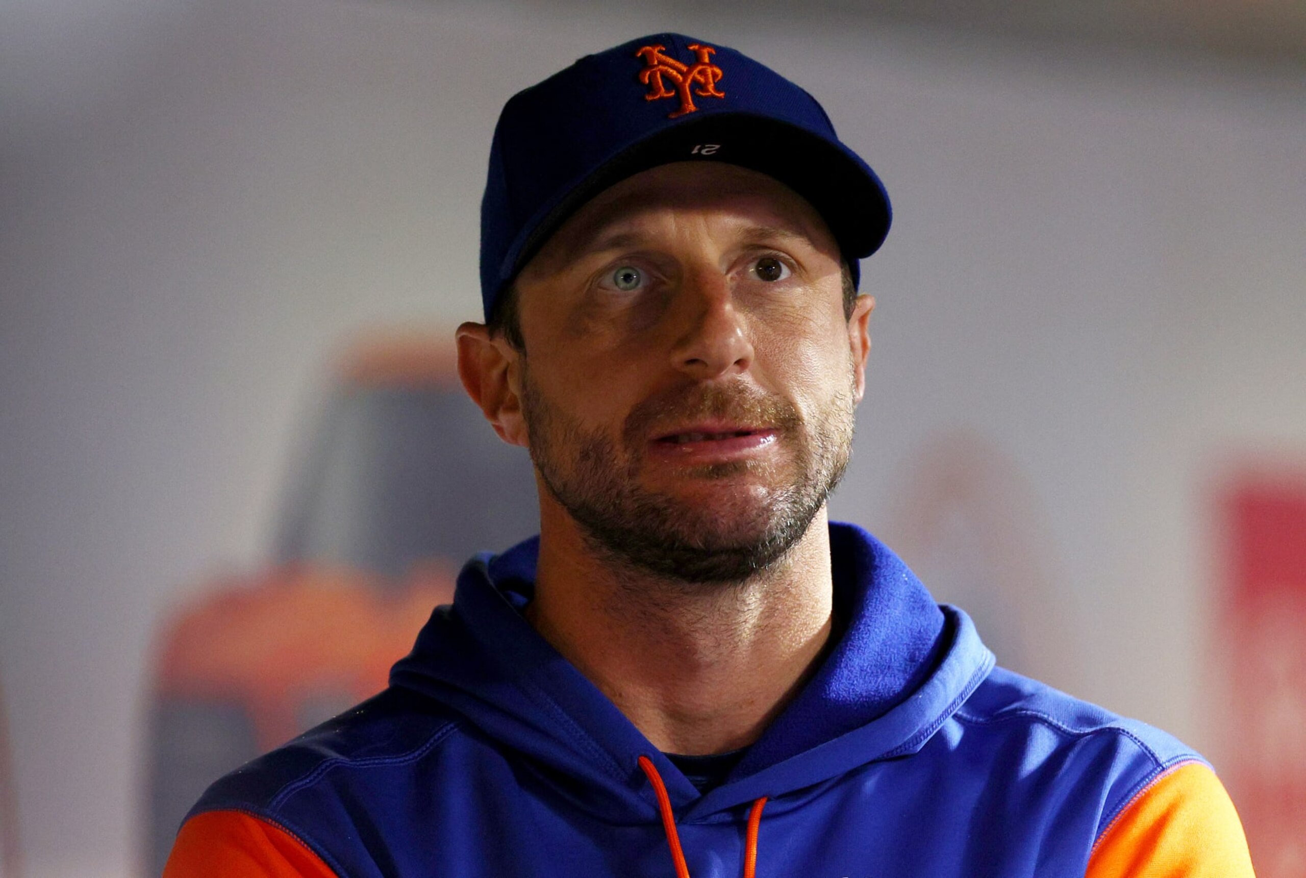 NEW YORK, NEW YORK - OCTOBER 05:  Max Scherzer #21 of the New York Mets looks on from the dugout in the third inning against the Washington Nationals at Citi Field on October 05, 2022 in the Flushing neighborhood of the Queens borough of New York City. (Photo by Elsa/Getty Images)