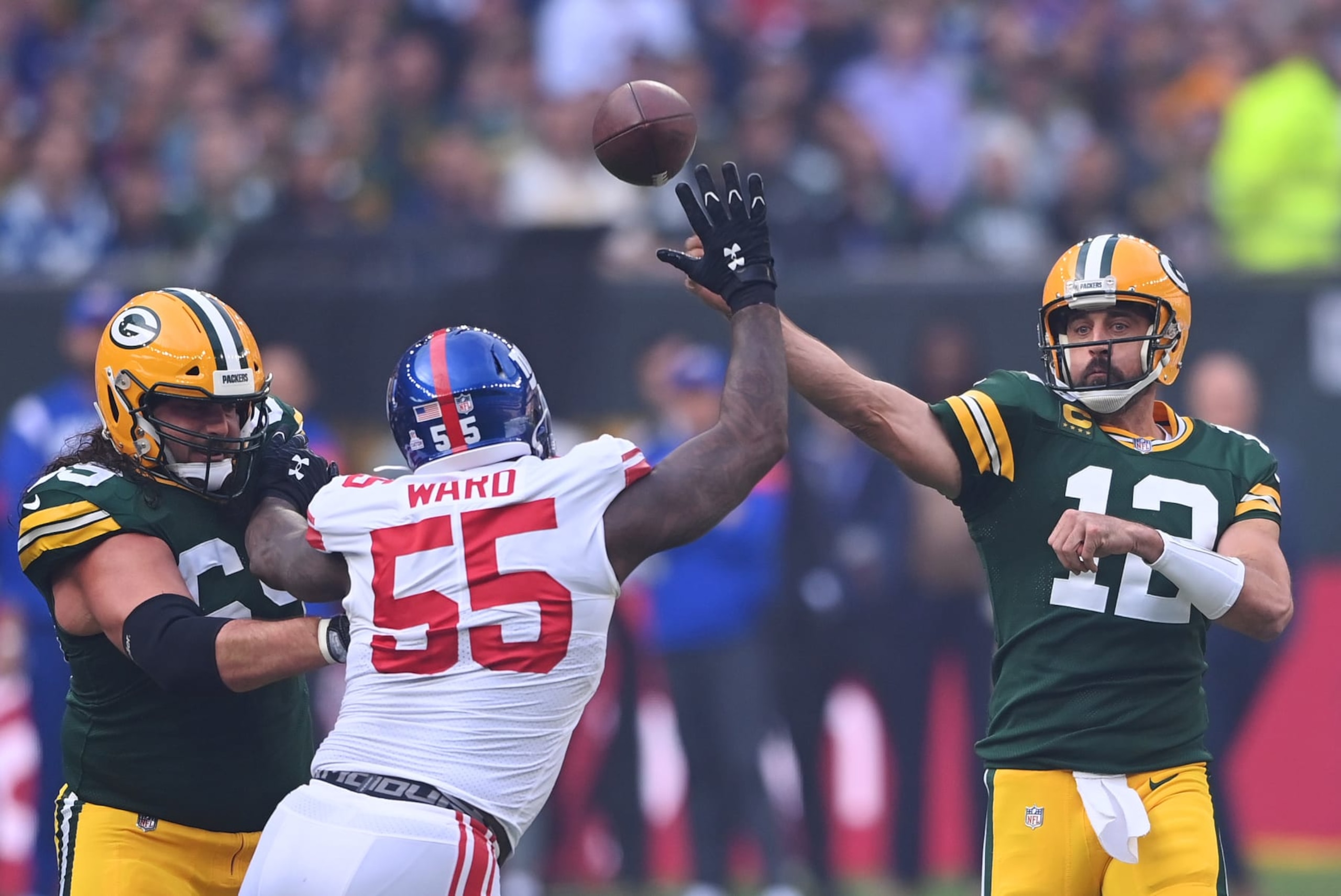 LONDON, ENGLAND - OCTOBER 09: Aaron Rodgers #12 of the Green Bay Packers throws a pass in the first half during the NFL match between New York Giants and Green Bay Packers at Tottenham Hotspur Stadium on October 09, 2022 in London, England. (Photo by Stu Forster/Getty Images)
