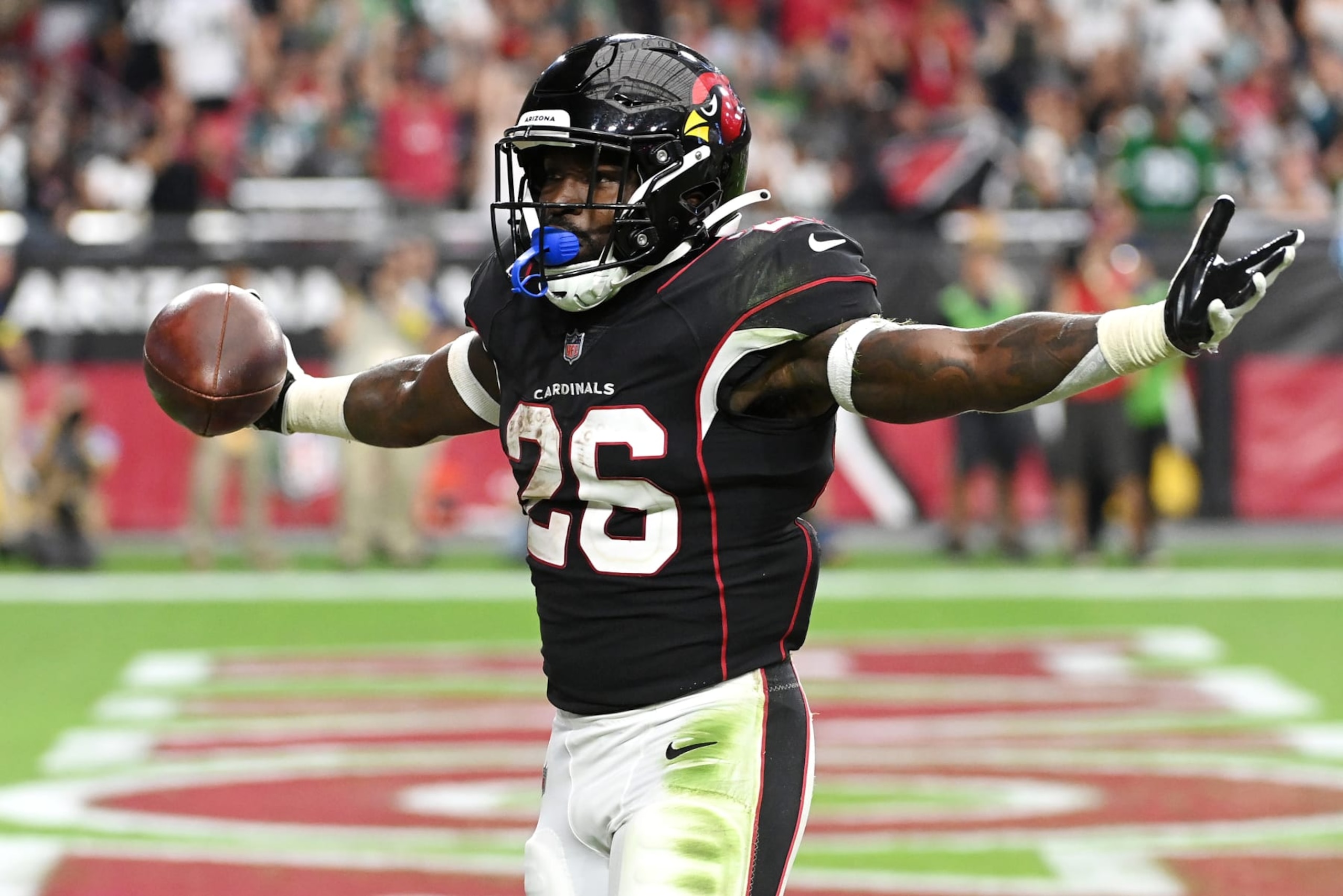 GLENDALE, ARIZONA - OCTOBER 09: Eno Benjamin #26 of the Arizona Cardinals celebrates after a touchdown during the fourth quarter against the Philadelphia Eagles at State Farm Stadium on October 09, 2022 in Glendale, Arizona. (Photo by Norm Hall/Getty Images)