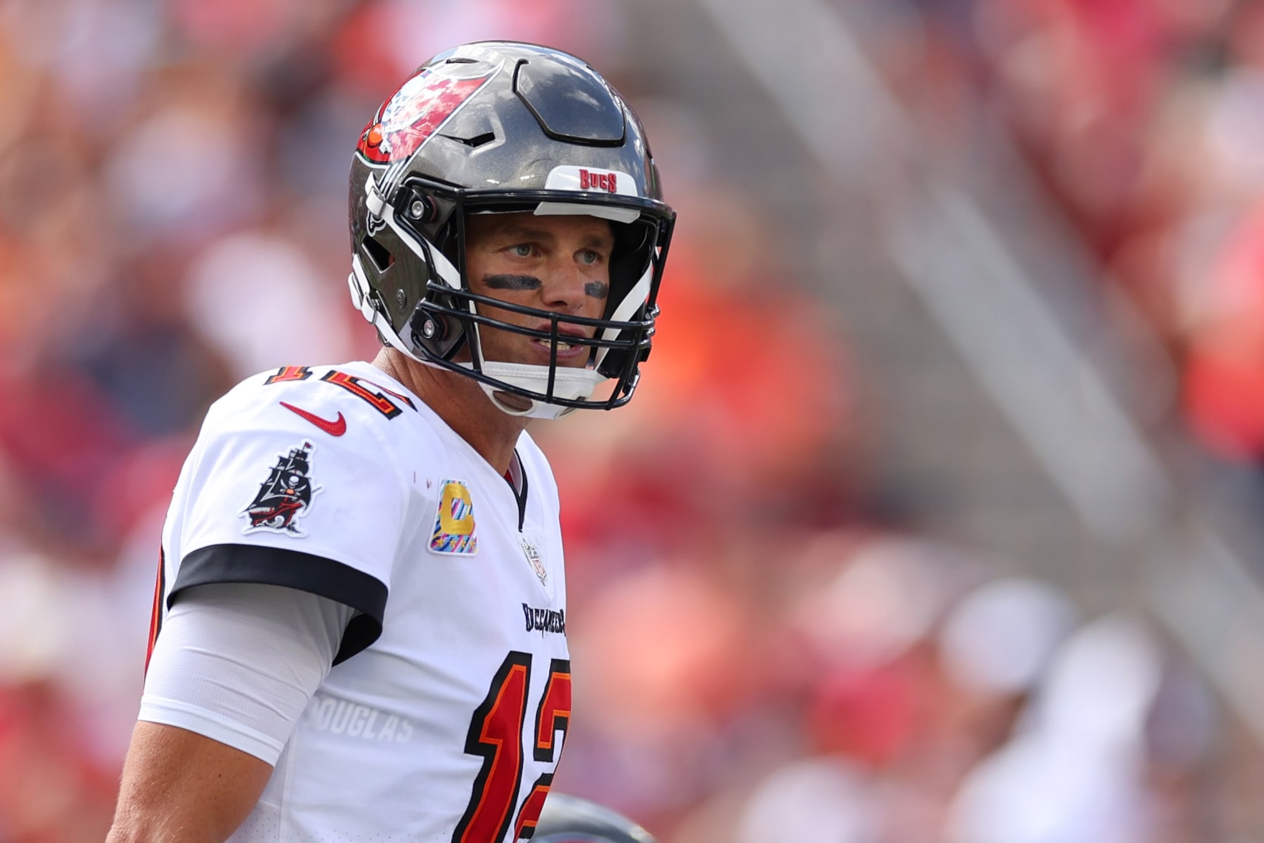 TAMPA, FLORIDA - OCTOBER 09: Tom Brady #12 of the Tampa Bay Buccaneers looks on during the second half in the game against the Atlanta Falcons at Raymond James Stadium on October 09, 2022 in Tampa, Florida. (Photo by Mike Ehrmann/Getty Images)