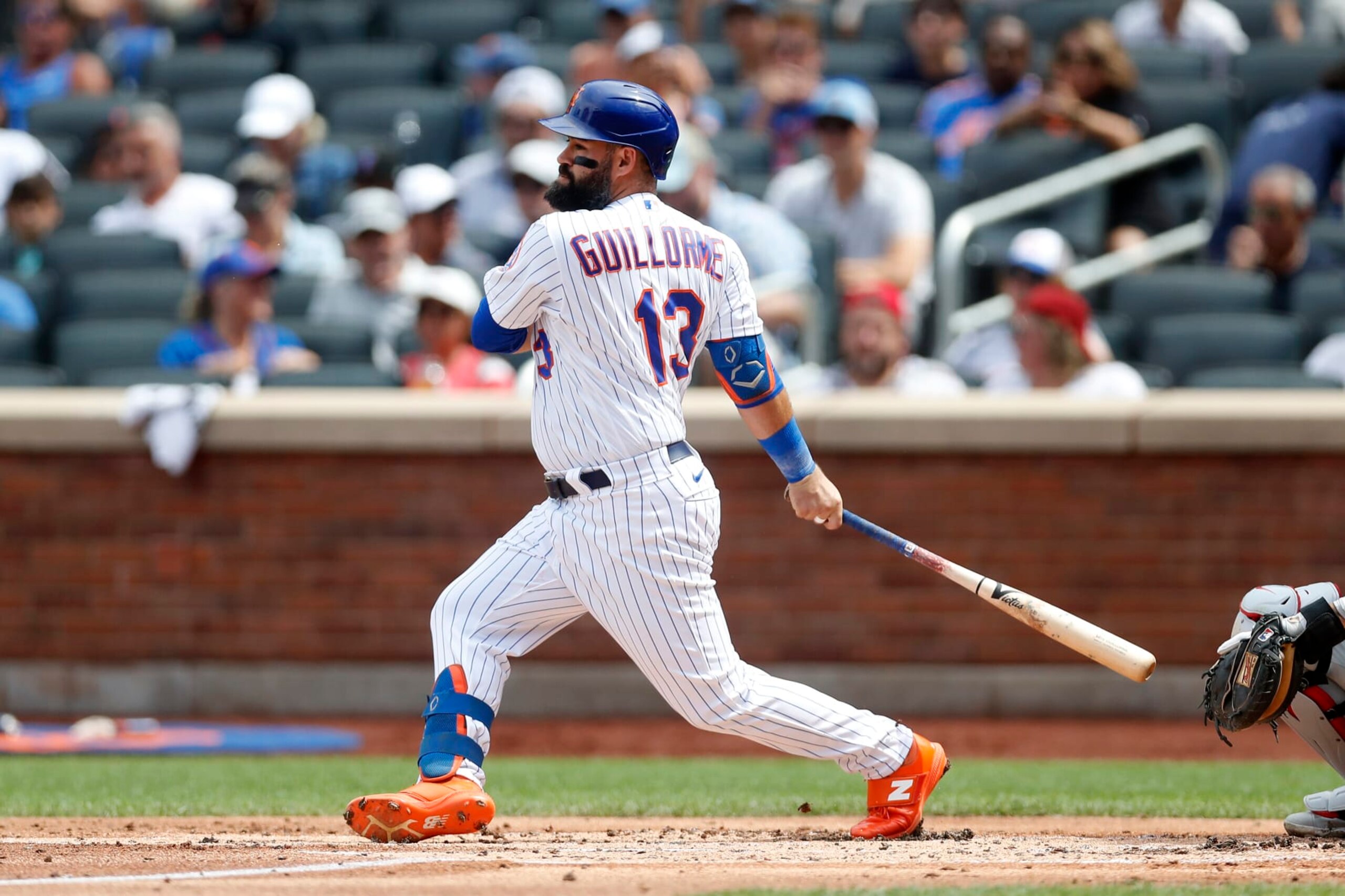 NEW YORK, NEW YORK - AUGUST 14:  Luis Guillorme #13 of the New York Mets in action against the Philadelphia Phillies at Citi Field on August 14, 2022 in New York City. The Mets defeated the Phillies 6-0. (Photo by Jim McIsaac/Getty Images)