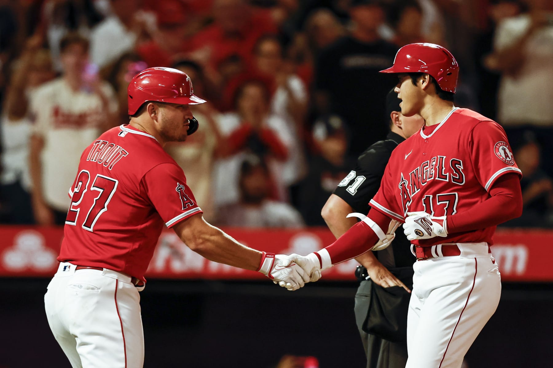 ANAHEIM, CALIFORNIA - AUGUST 29: Shohei Ohtani #17 of the Los Angeles Angels celebrates with his teammate Mike Trout #27 after hitting a two-run home run against the New York Yankees during the fifth inning at Angel Stadium of Anaheim on August 29, 2022 in Anaheim, California. (Photo by Michael Owens/Getty Images)