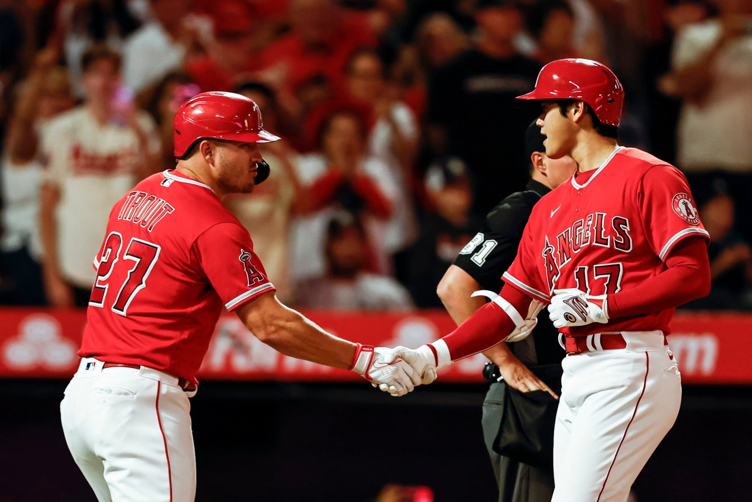 ANAHEIM, CALIFORNIA - AUGUST 29: Shohei Ohtani #17 of the Los Angeles Angels celebrates with his teammate Mike Trout #27 after hitting a two-run home run against the New York Yankees during the fifth inning at Angel Stadium of Anaheim on August 29, 2022 in Anaheim, California. (Photo by Michael Owens/Getty Images)