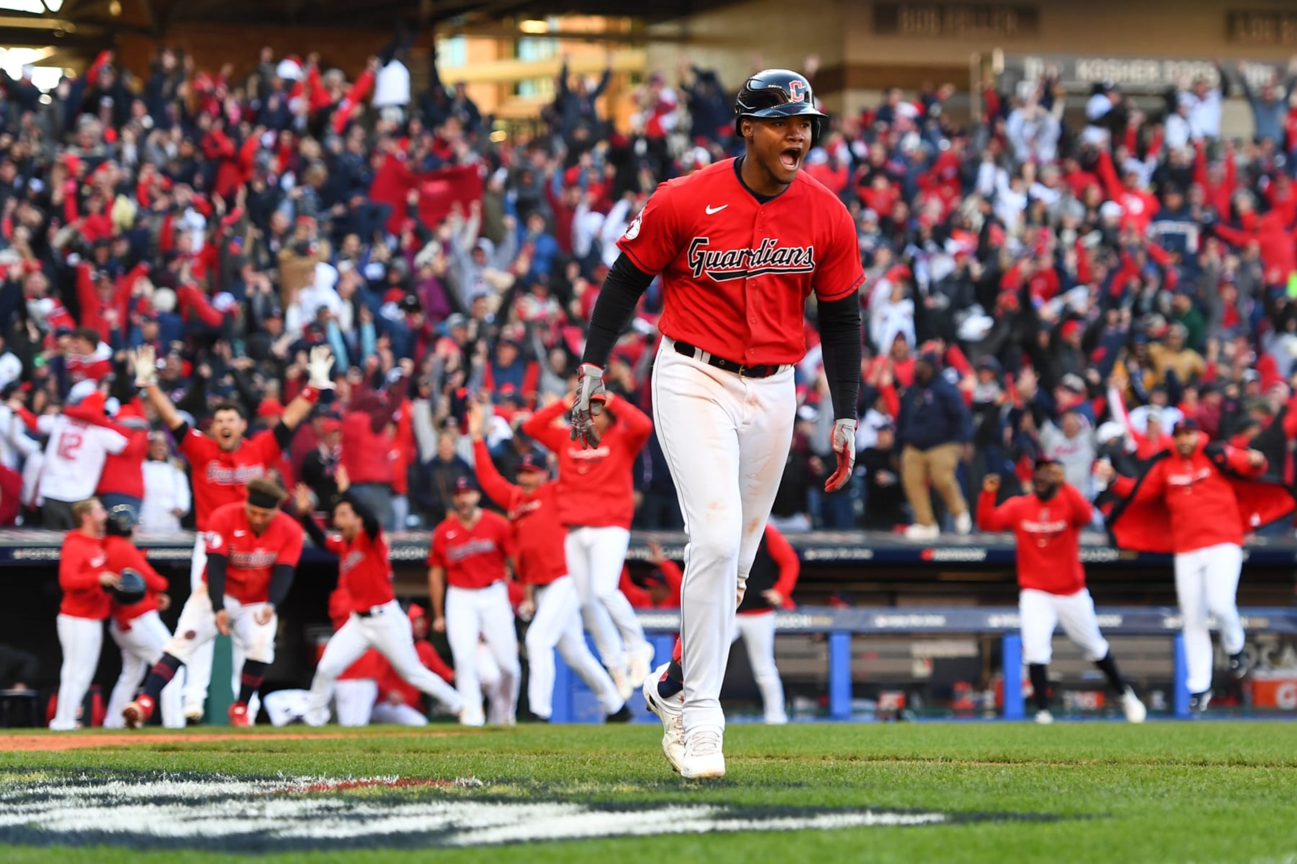CLEVELAND, OH - OCTOBER 08: Oscar Gonzalez #39 of the Cleveland Guardians celebrates after hitting a walk-off home run in the 15th inning to defeat the Tampa Bay Rays during the Wild Card Series game at Progressive Field on Saturday, October 8, 2022 in Cleveland, Ohio. (Photo by Joe Sargent/MLB Photos via Getty Images)