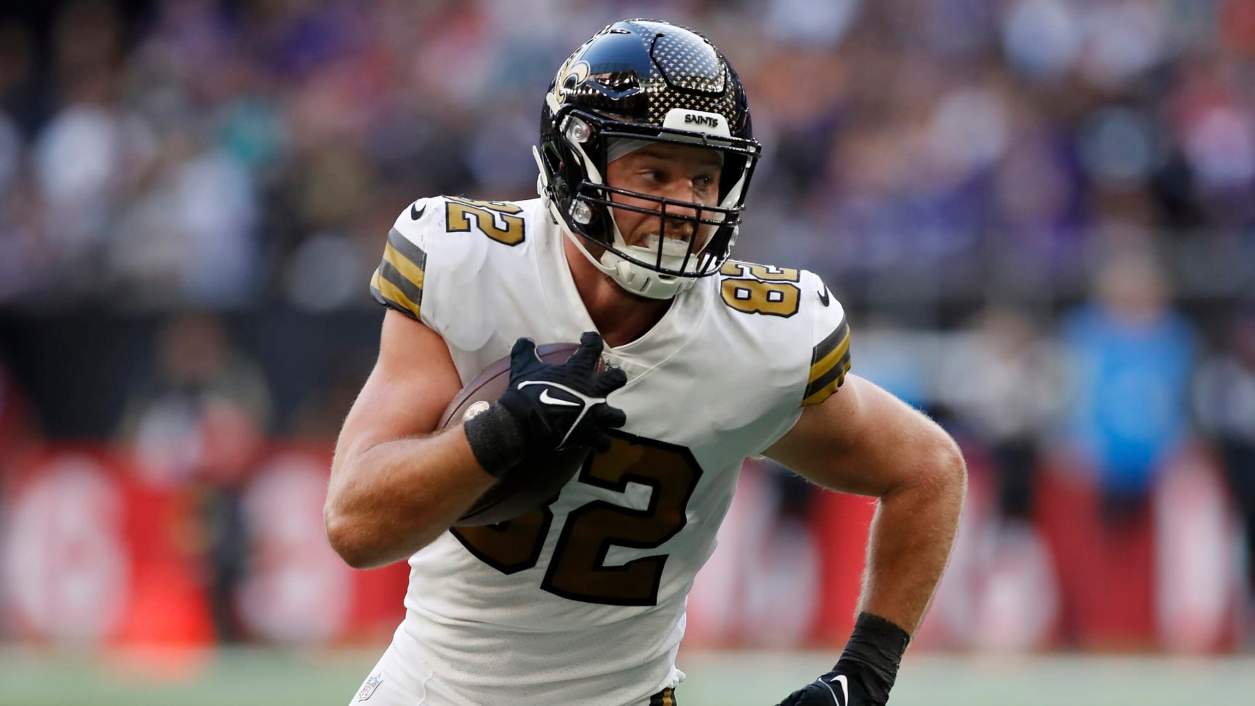 New Orleans Saints tight end Adam Trautman (82) runs the ball during an NFL football game against the Minnesota Vikings at Tottenham Hotspur Stadium, Sunday, Oct. 2, 2022, in London. The Minnesota Vikings won 28-25. (AP Photo/Steve Luciano) New Orleans Saints tight end Adam Trautman (82) runs the ball during an NFL football game against the Minnesota Vikings at Tottenham Hotspur Stadium, Sunday, Oct. 2, 2022, in London. The Minnesota Vikings won 28-25. (AP Photo/Steve Luciano)