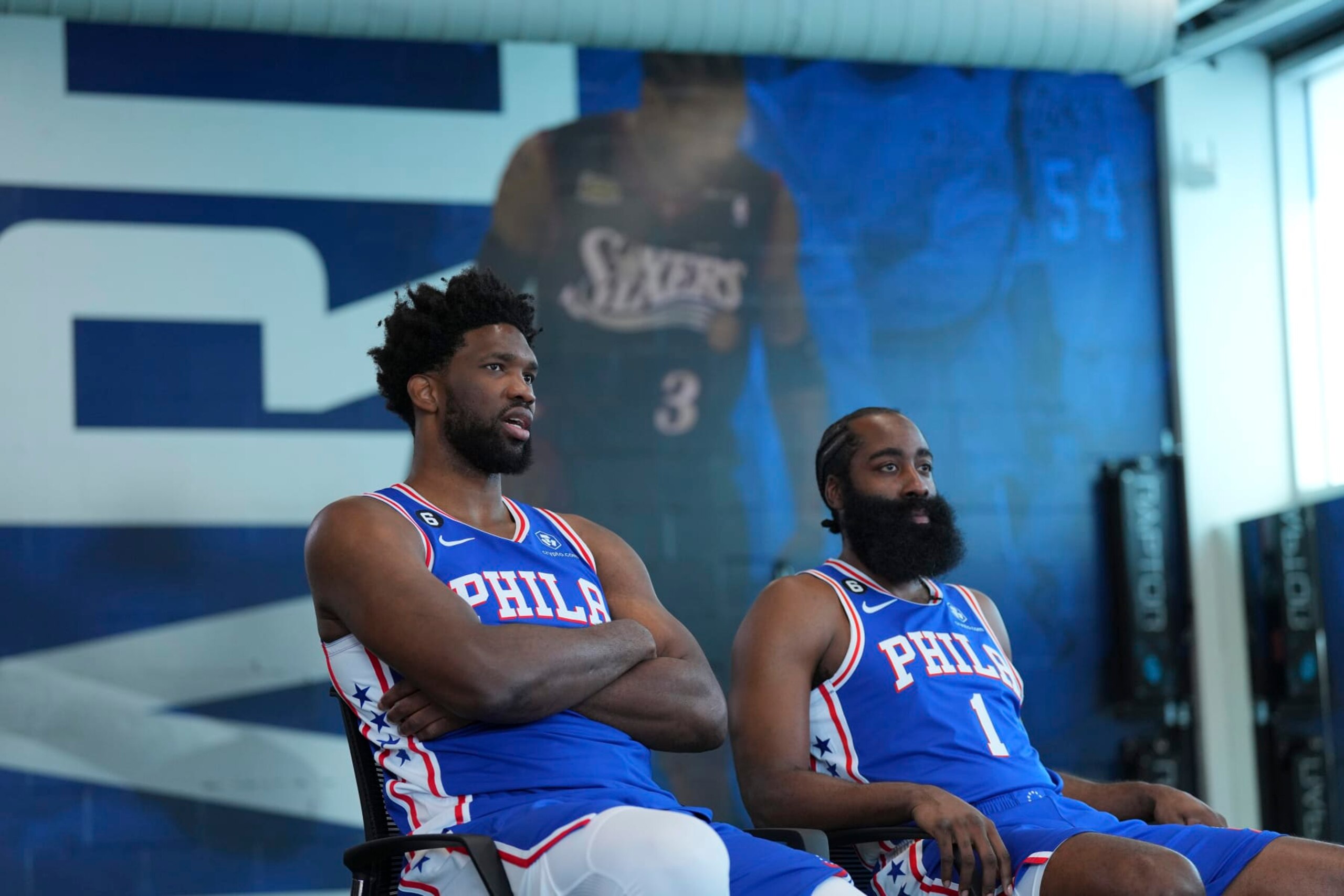 CAMDEN, NJ - SEPTEMBER 26: Joel Embiid #21 and James Harden #1 of the Philadelphia 76ers sit for an interview during media day at the 76ers Training Complex on September 26, 2022 in Camden, New Jersey. NOTE TO USER: User expressly acknowledges and agrees that, by downloading and or using this photograph, User is consenting to the terms and conditions of the Getty Images License Agreement. (Photo by Mitchell Leff/Getty Images)