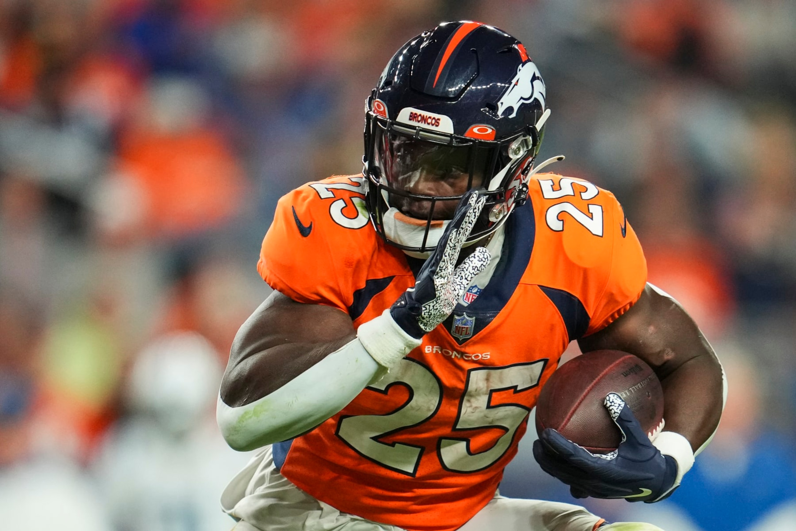 DENVER, CO - OCTOBER 06: Melvin Gordon III #25 of the Denver Broncos runs the ball against the Indianapolis Colts at Empower Field at Mile High on October 6, 2022 in Denver, Texas. (Photo by Cooper Neill/Getty Images)