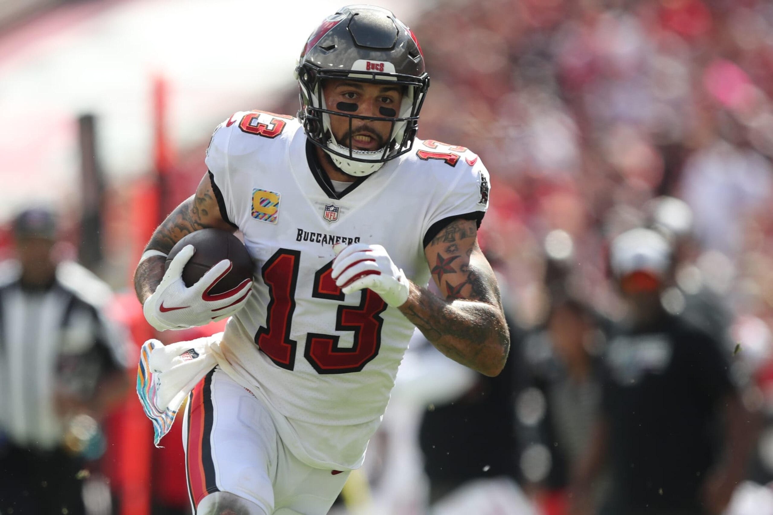 TAMPA, FL - OCTOBER 09: Tampa Bay Buccaneers Wide Receiver Mike Evans (13) makes the catch and runs with the ball during the regular season game between the Atlanta Falcons and the Tampa Bay Buccaneers on October 09, 2022 at Raymond James Stadium in Tampa, Florida. (Photo by Cliff Welch/Icon Sportswire via Getty Images)