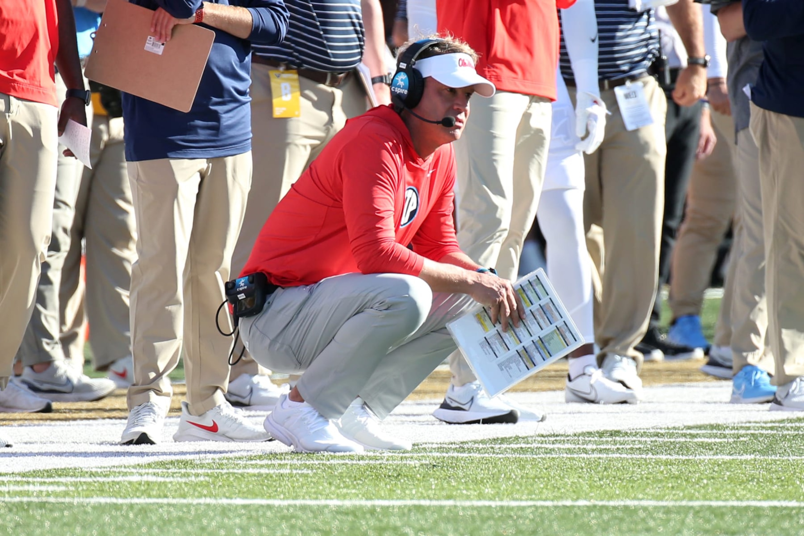 NASHVILLE, VA - OCTOBER 08: Mississippi Rebels head coach Lane Kiffin squats on the sideline as he watches a  play during a game between the Vanderbilt Commodores and Mississippi Rebels, October 8, 2022 at FirstBank Stadium, in Nashville, Tennessee. Photo by Matthew Maxey/Icon Sportswire via Getty Images)