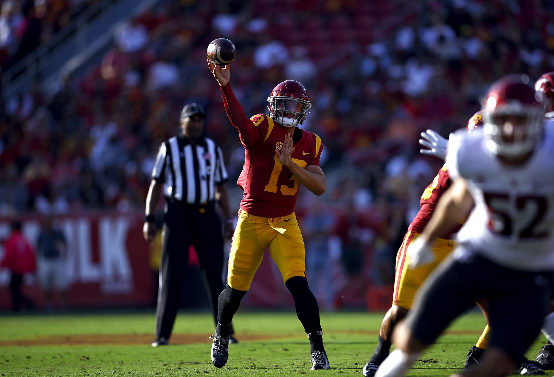 LOS ANGELES, CALIFORNIA - OCTOBER 08:   Caleb Williams #13 of the USC Trojans throws against the Washington State Cougars in the first quarter at United Airlines Field at the Los Angeles Memorial Coliseum on October 08, 2022 in Los Angeles, California. (Photo by Ronald Martinez/Getty Images)