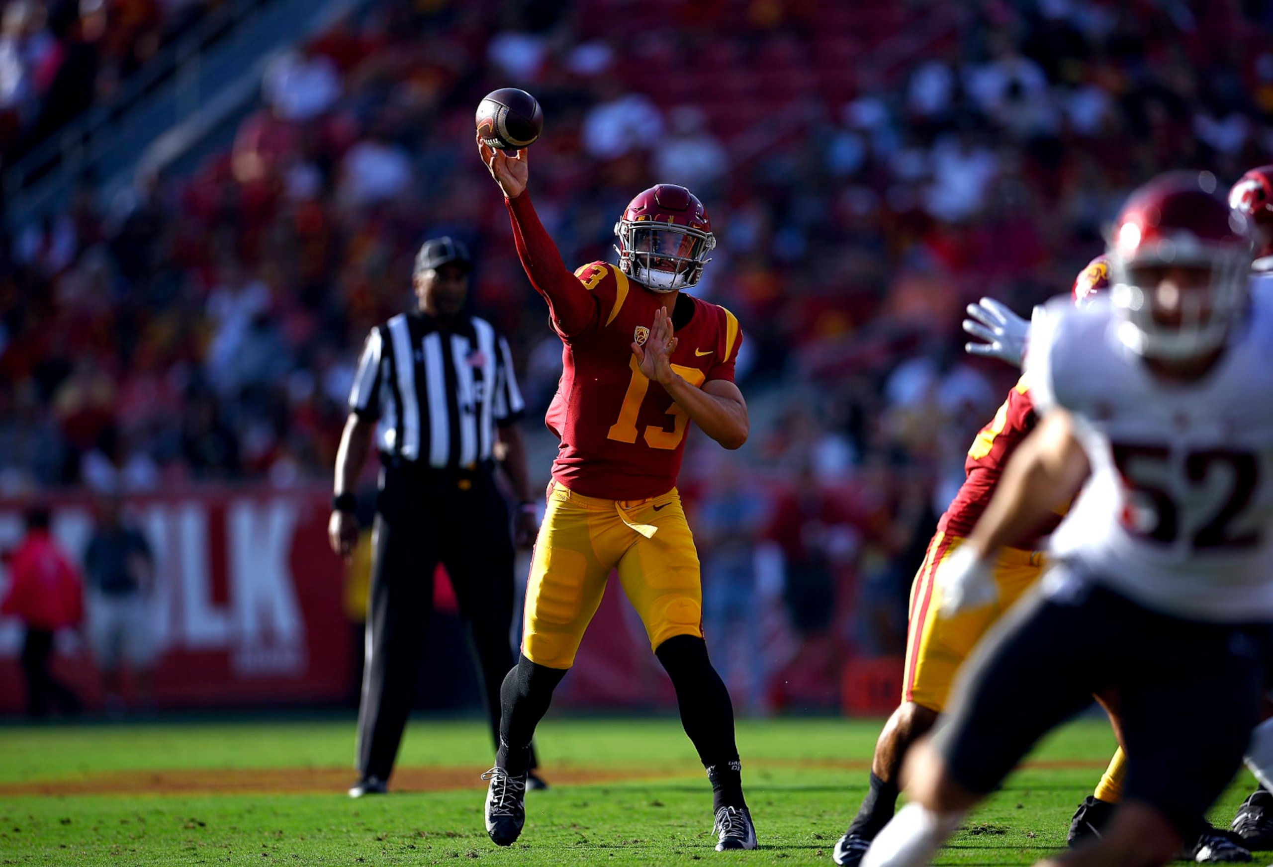 LOS ANGELES, CALIFORNIA - OCTOBER 08:   Caleb Williams #13 of the USC Trojans throws against the Washington State Cougars in the first quarter at United Airlines Field at the Los Angeles Memorial Coliseum on October 08, 2022 in Los Angeles, California. (Photo by Ronald Martinez/Getty Images)