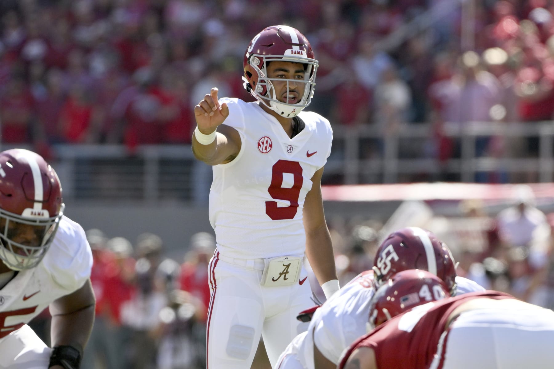 Alabama quarterback Bryce Young (9) gets ready to run a play against Arkansas during the first half of an NCAA college football game Saturday, Oct. 1, 2022, in Fayetteville, Ark. (AP Photo/Michael Woods)