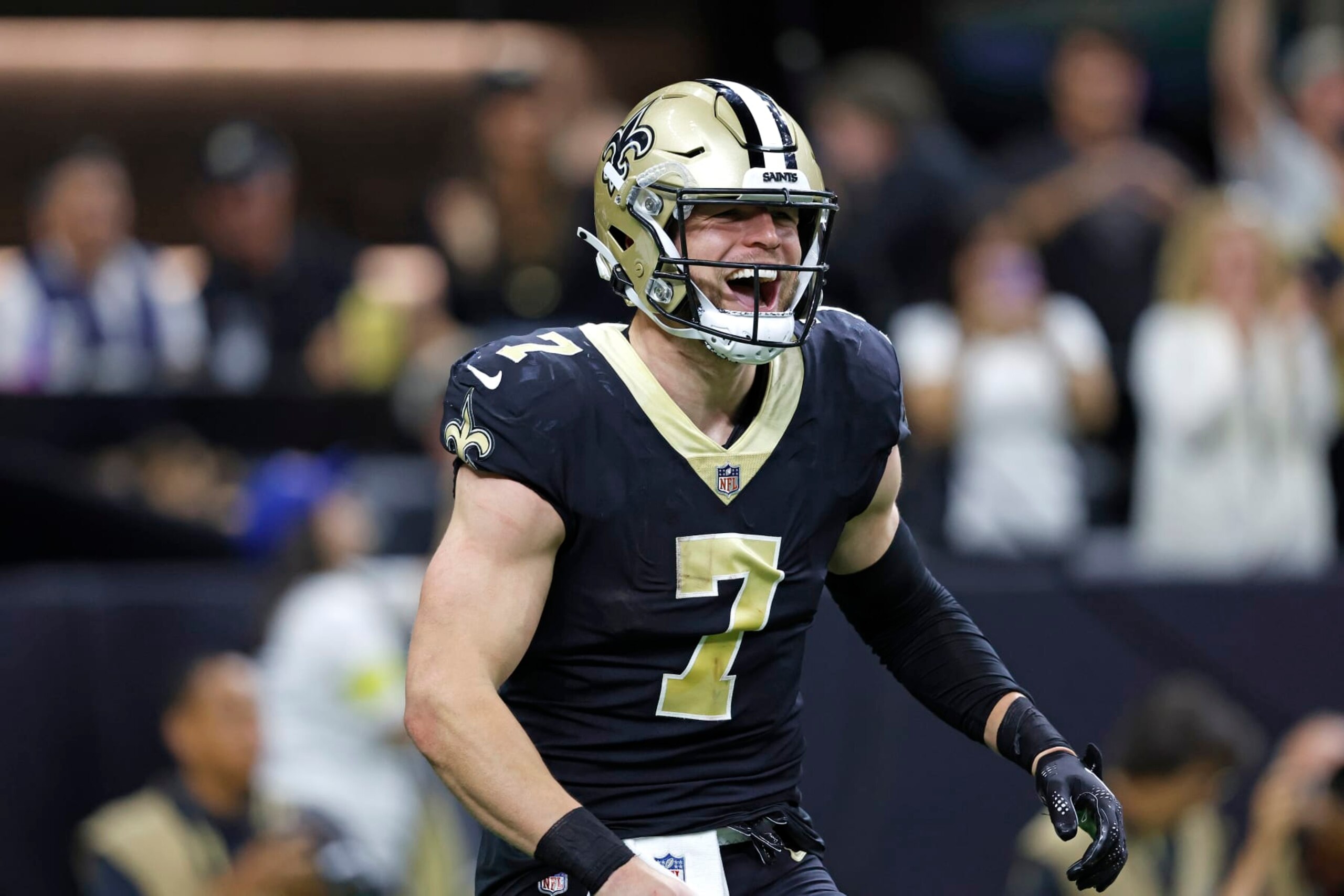 New Orleans Saints tight end Taysom Hill (7) celebrates after throwing a touchdown pass during an NFL football game against the Seattle Seahawks, Sunday, Oct. 9, 2022, in New Orleans. (AP Photo/Tyler Kaufman)