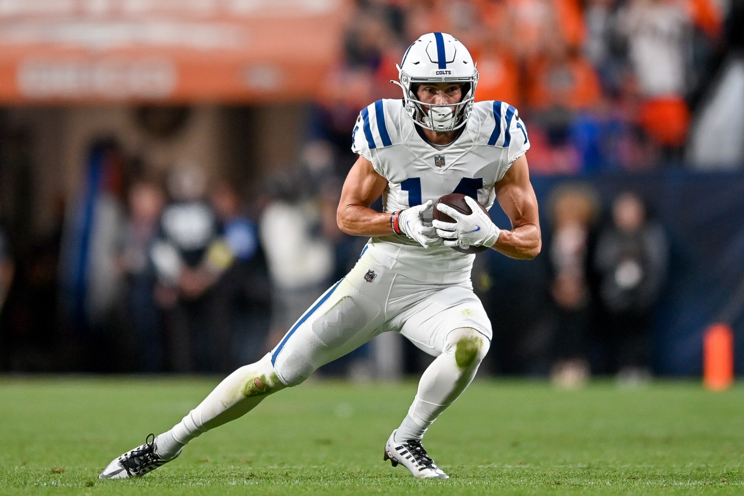 DENVER, COLORADO - OCTOBER 6:  Wide receiver Alec Pierce #14 of the Indianapolis Colts runs after a catch against the Denver Broncos at Empower Field at Mile High on October 6, 2022 in Denver, Colorado. (Photo by Dustin Bradford/Getty Images)