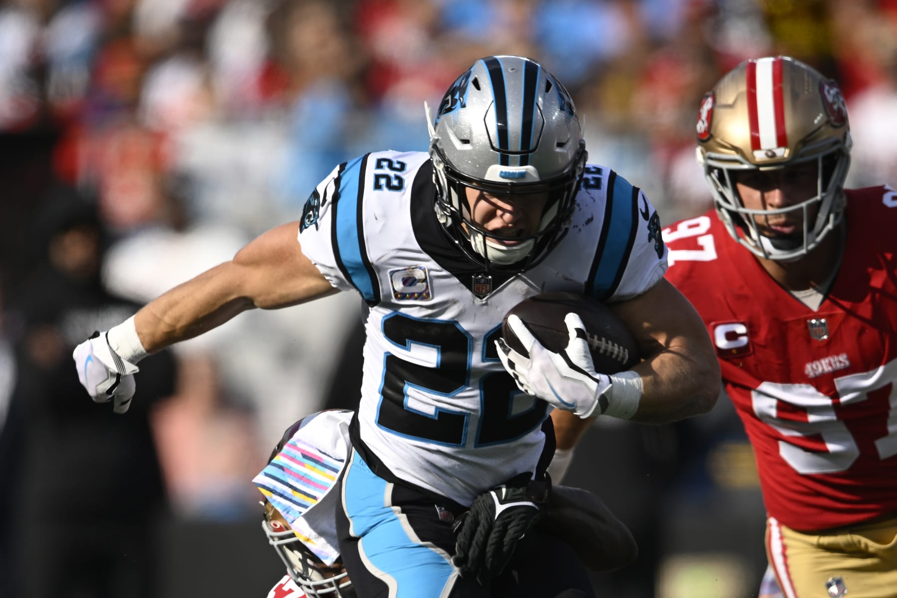CHARLOTTE, NORTH CAROLINA - OCTOBER 09: Christian McCaffrey #22 of the Carolina Panthers runs the ball during the first half in the game against the San Francisco 49ers at Bank of America Stadium on October 09, 2022 in Charlotte, North Carolina. (Photo by Eakin Howard/Getty Images)
