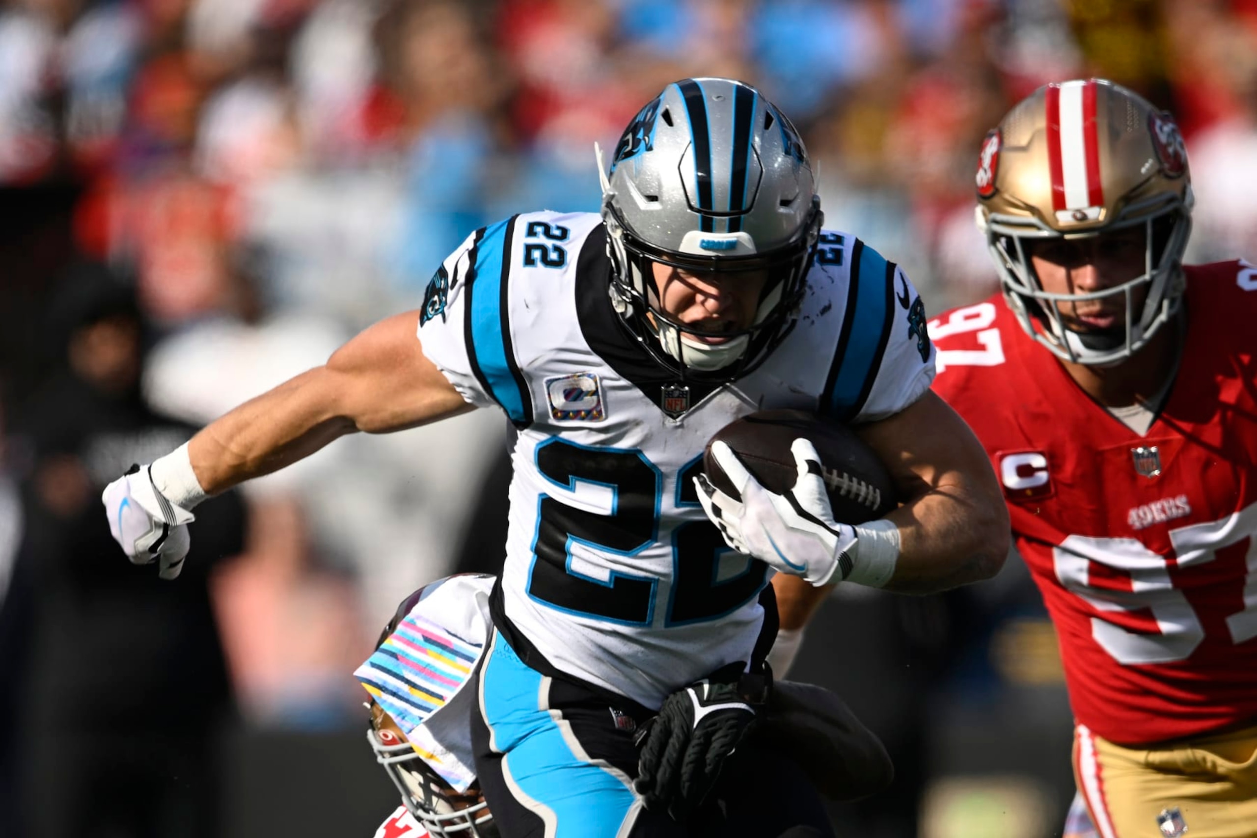 CHARLOTTE, NORTH CAROLINA - OCTOBER 09: Christian McCaffrey #22 of the Carolina Panthers runs the ball during the first half in the game against the San Francisco 49ers at Bank of America Stadium on October 09, 2022 in Charlotte, North Carolina. (Photo by Eakin Howard/Getty Images)