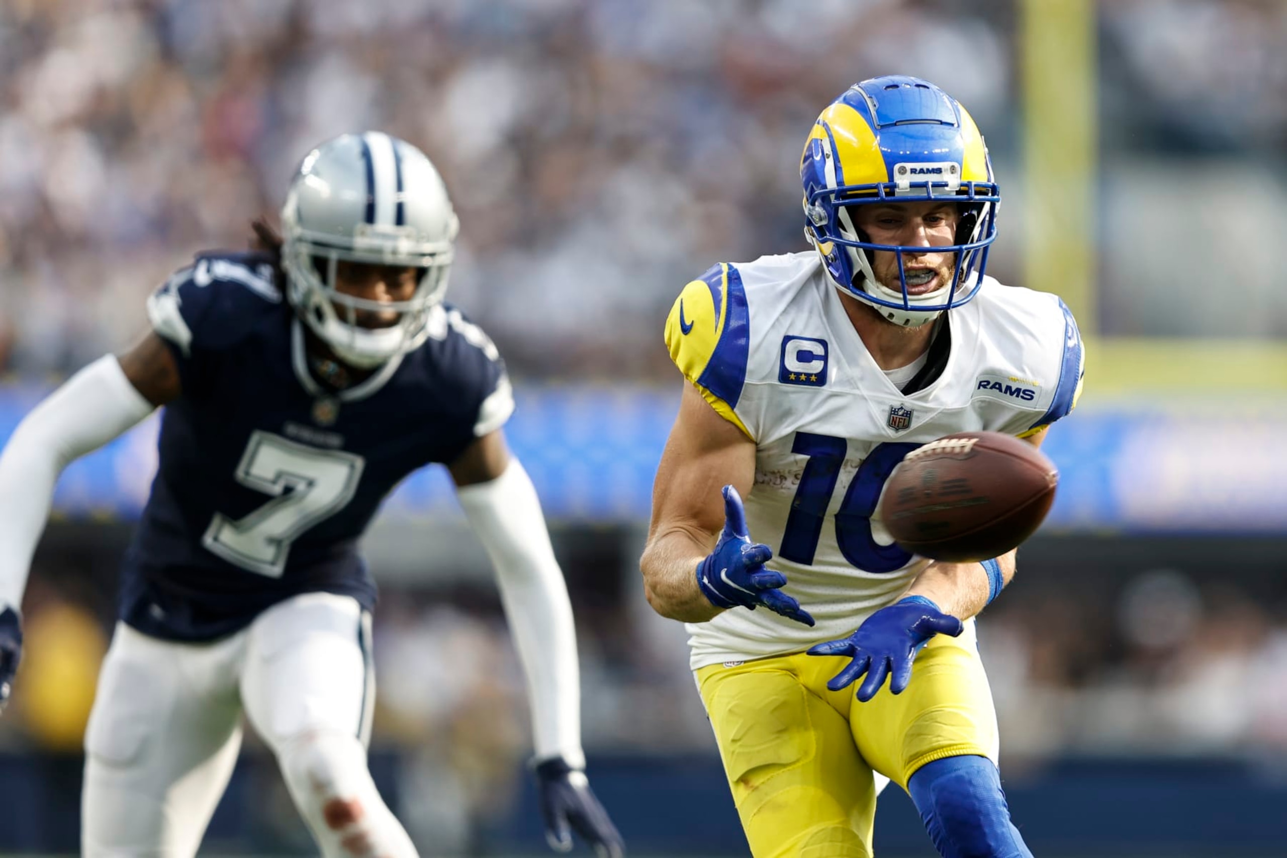 INGLEWOOD, CALIFORNIA - OCTOBER 09: Cooper Kupp #10 of the Los Angeles Rams completes a pass against Trevon Diggs #7 of the Dallas Cowboys during an NFL football game between the Los Angeles Rams and the Dallas Cowboys at SoFi Stadium on October 09, 2022 in Inglewood, California. (Photo by Michael Owens/Getty Images)