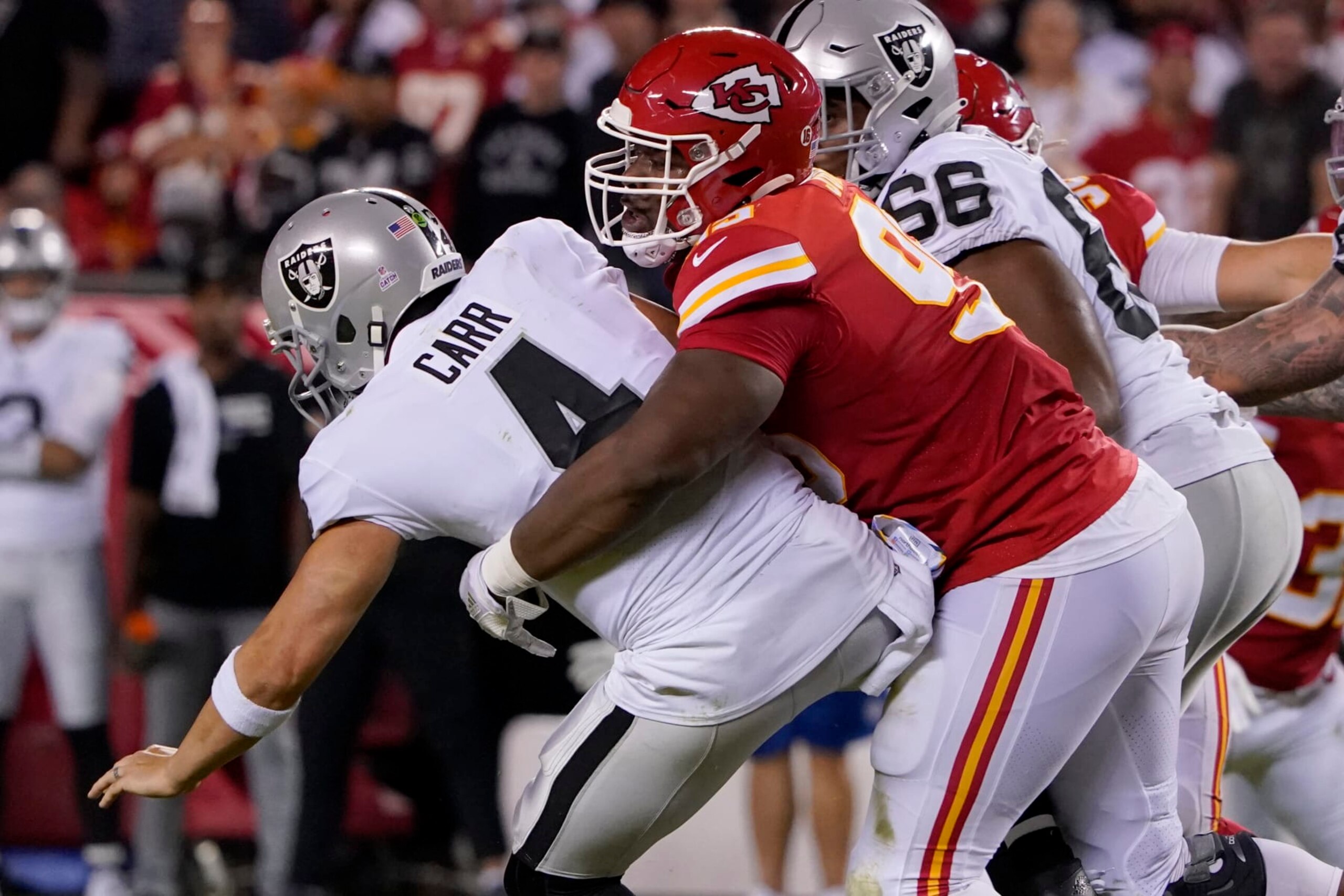 Las Vegas Raiders quarterback Derek Carr (4) is sacked by Kansas City Chiefs defensive tackle Chris Jones, right, during the first half of an NFL football game Monday, Oct. 10, 2022, in Kansas City, Mo. (AP Photo/Ed Zurga) Las Vegas Raiders quarterback Derek Carr (4) is sacked by Kansas City Chiefs defensive tackle Chris Jones, right, during the first half of an NFL football game Monday, Oct. 10, 2022, in Kansas City, Mo. (AP Photo/Ed Zurga)