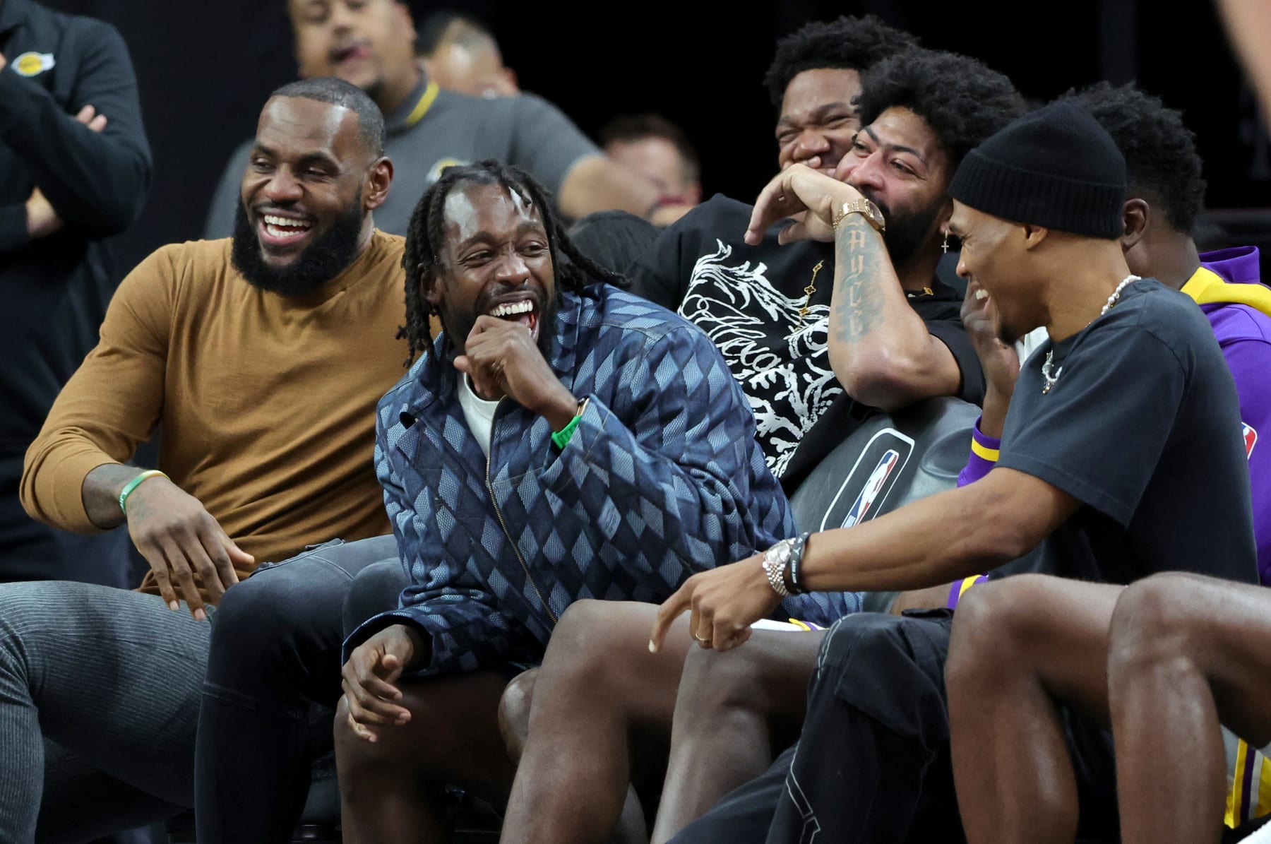 LAS VEGAS, NEVADA - OCTOBER 06: (L-R) LeBron James #6, Patrick Beverley #21, Anthony Davis #3 and Russell Westbrook #0 of the Los Angeles Lakers laugh on the bench in the fourth quarter of a preseason game against the Minnesota Timberwolves at T-Mobile Arena on October 06, 2022 in Las Vegas, Nevada. The Timberwolves defeated the Lakers 114-99. NOTE TO USER: User expressly acknowledges and agrees that, by downloading and or using this photograph, User is consenting to the terms and conditions of the Getty Images License Agreement. (Photo by Ethan Miller/Getty Images)