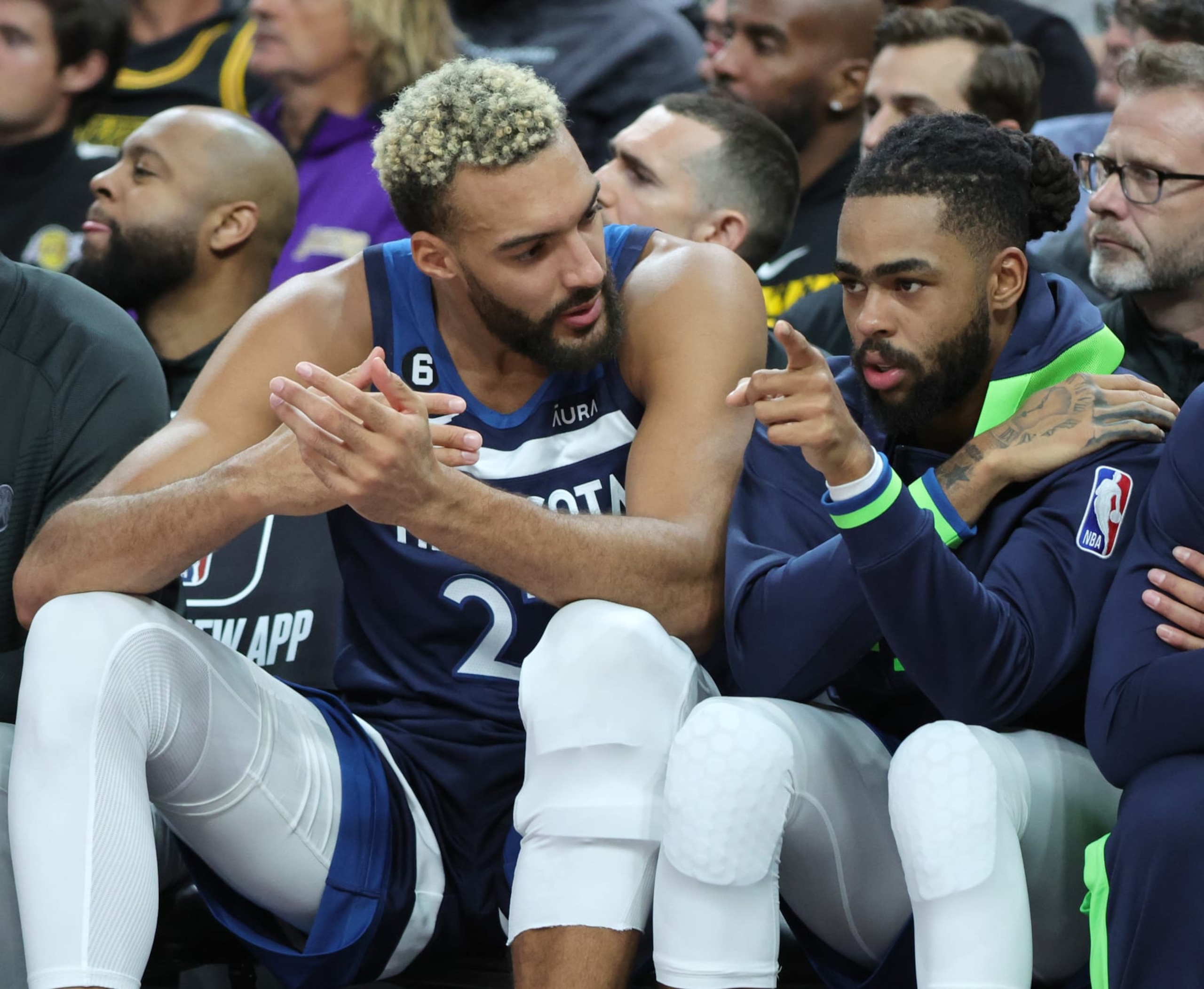 LAS VEGAS, NEVADA - OCTOBER 06: Rudy Gobert #27 and D'Angelo Russell #0 of the Minnesota Timberwolves talk on the bench in the first quarter of their preseason game against the Los Angeles Lakers at T-Mobile Arena on October 06, 2022 in Las Vegas, Nevada. The Timberwolves defeated the Lakers 114-99. NOTE TO USER: User expressly acknowledges and agrees that, by downloading and or using this photograph, User is consenting to the terms and conditions of the Getty Images License Agreement. (Photo by Ethan Miller/Getty Images) LAS VEGAS, NEVADA - OCTOBER 06: Rudy Gobert #27 and D'Angelo Russell #0 of the Minnesota Timberwolves talk on the bench in the first quarter of their preseason game against the Los Angeles Lakers at T-Mobile Arena on October 06, 2022 in Las Vegas, Nevada. The Timberwolves defeated the Lakers 114-99. NOTE TO USER: User expressly acknowledges and agrees that, by downloading and or using this photograph, User is consenting to the terms and conditions of the Getty Images License Agreement. (Photo by Ethan Miller/Getty Images)