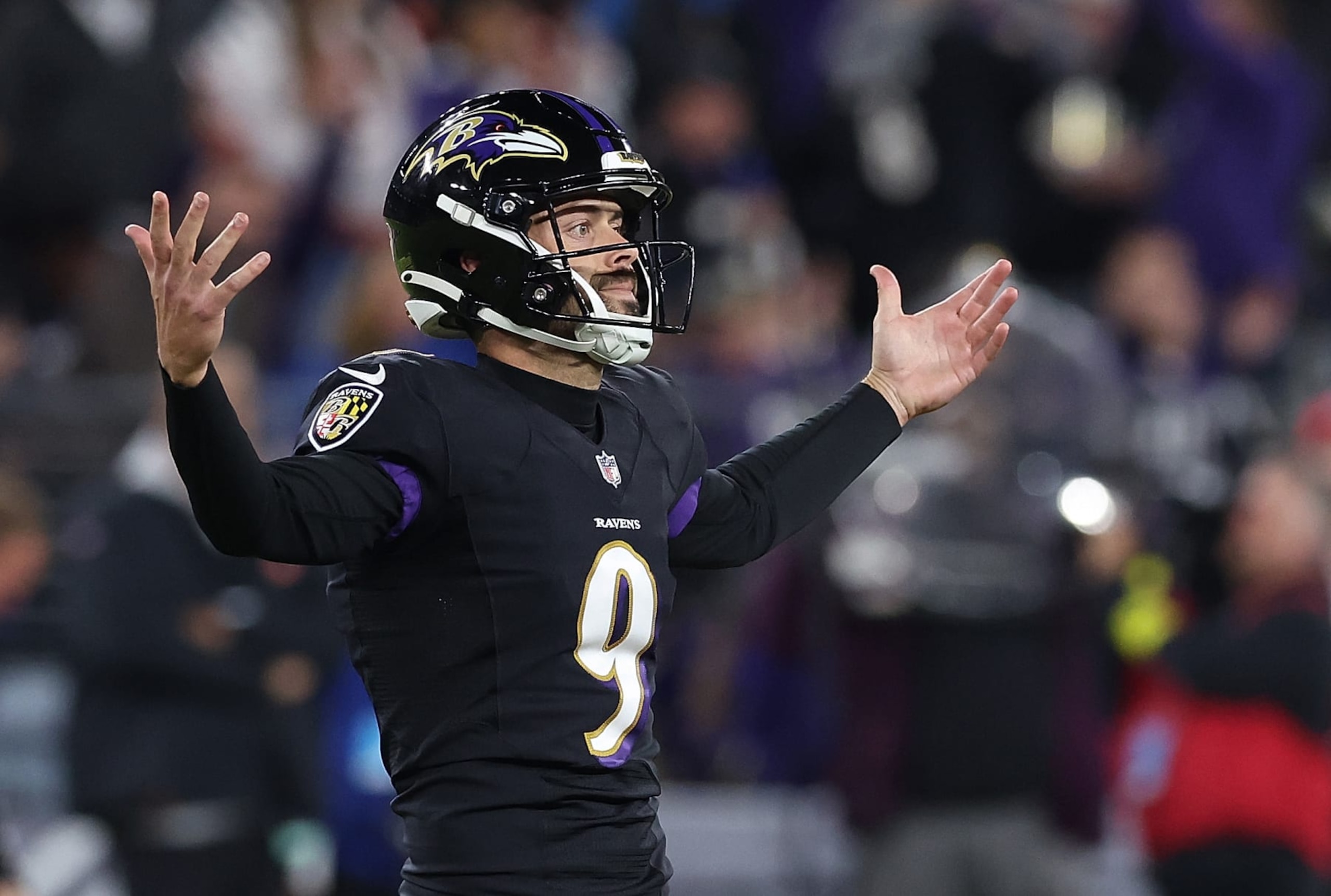 BALTIMORE, MARYLAND - OCTOBER 09:  Justin Tucker #9 of the Baltimore Ravens reacts after kicking a field goal in the third quarter against the Cincinnati Bengals at M&T Bank Stadium on October 09, 2022 in Baltimore, Maryland. (Photo by Todd Olszewski/Getty Images)