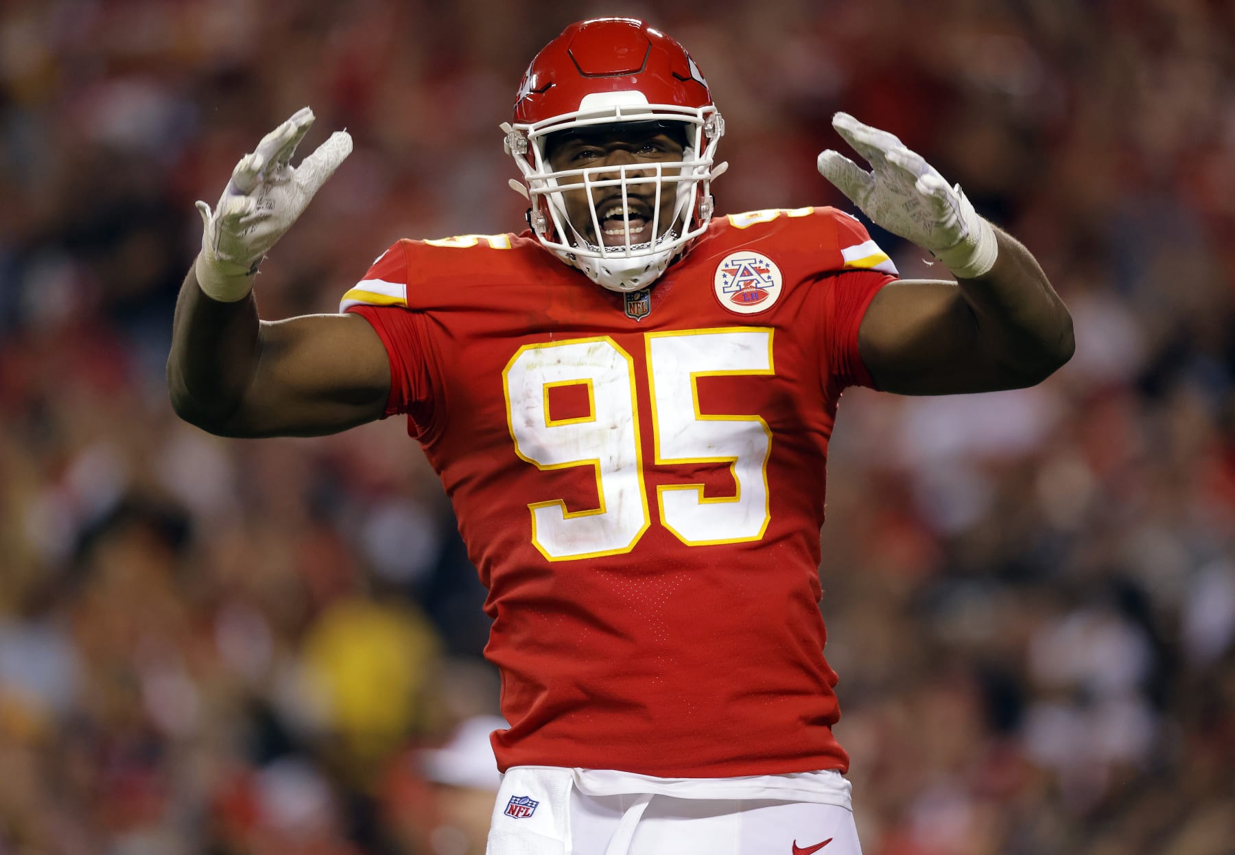 KANSAS CITY, MISSOURI - OCTOBER 10:  Chris Jones #95 of the Kansas City Chiefs celebrates a delay-of-game penalty due to crowd noise during the 2nd half of the game against the Las Vegas Raiders at Arrowhead Stadium on October 10, 2022 in Kansas City, Missouri. (Photo by David Eulitt/Getty Images)