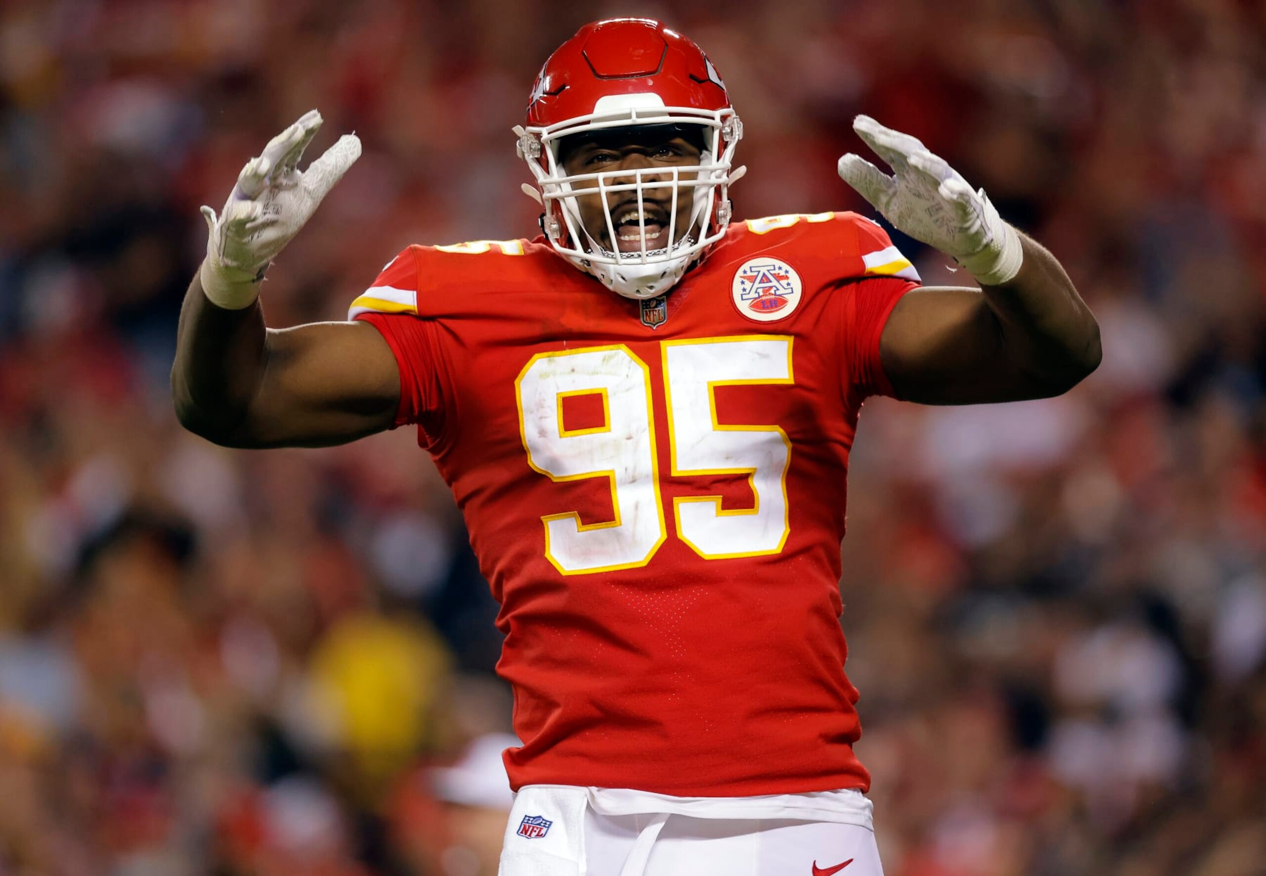 KANSAS CITY, MISSOURI - OCTOBER 10:  Chris Jones #95 of the Kansas City Chiefs celebrates a delay-of-game penalty due to crowd noise during the 2nd half of the game against the Las Vegas Raiders at Arrowhead Stadium on October 10, 2022 in Kansas City, Missouri. (Photo by David Eulitt/Getty Images)