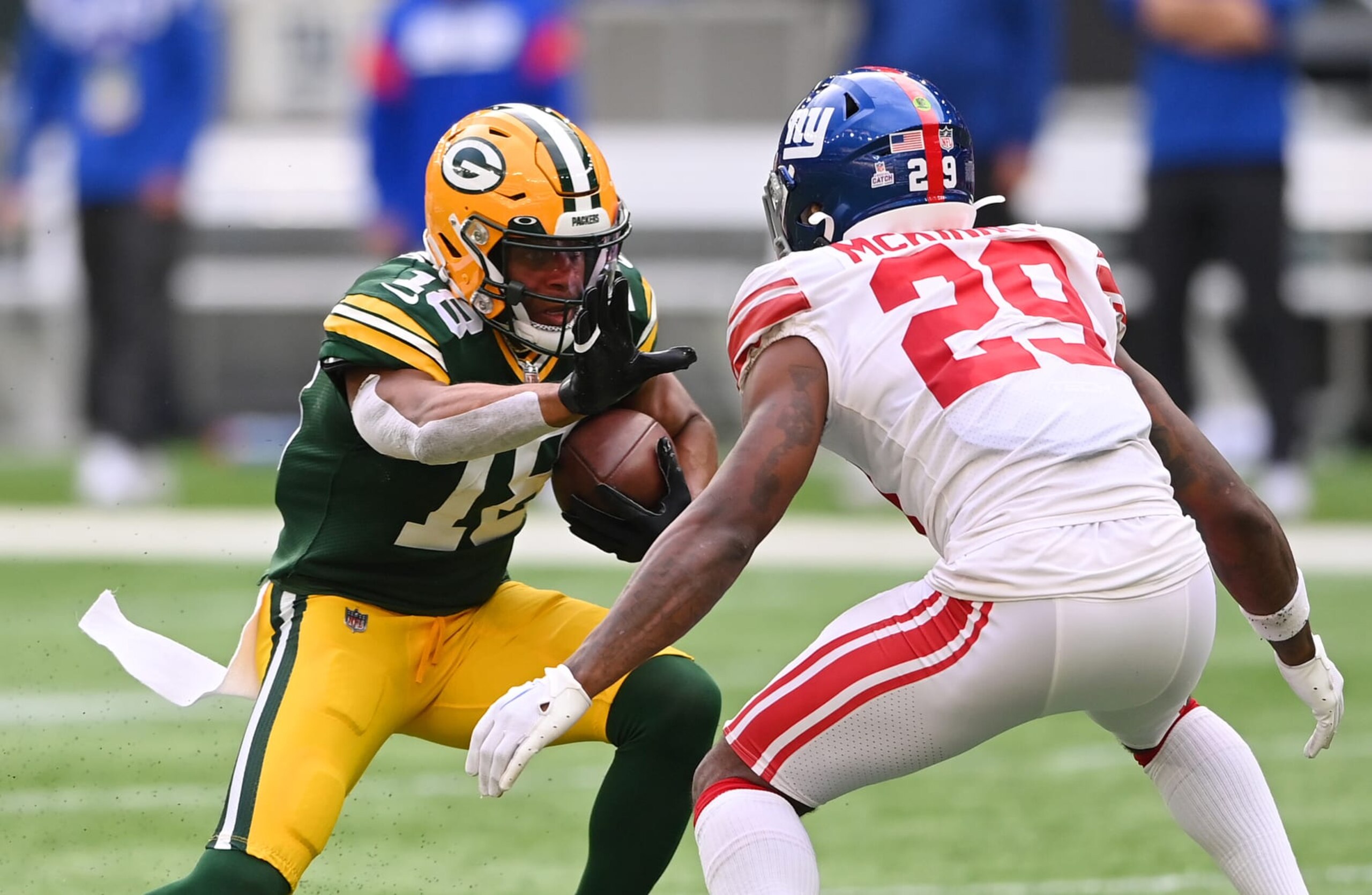 LONDON, ENGLAND - OCTOBER 09: Randall Cobb #18 of the Green Bay Packers runs with the ball from Xavier McKinney #29 of the New York Giants in the second half during the NFL match between New York Giants and Green Bay Packers at Tottenham Hotspur Stadium on October 09, 2022 in London, England. (Photo by Stu Forster/Getty Images)