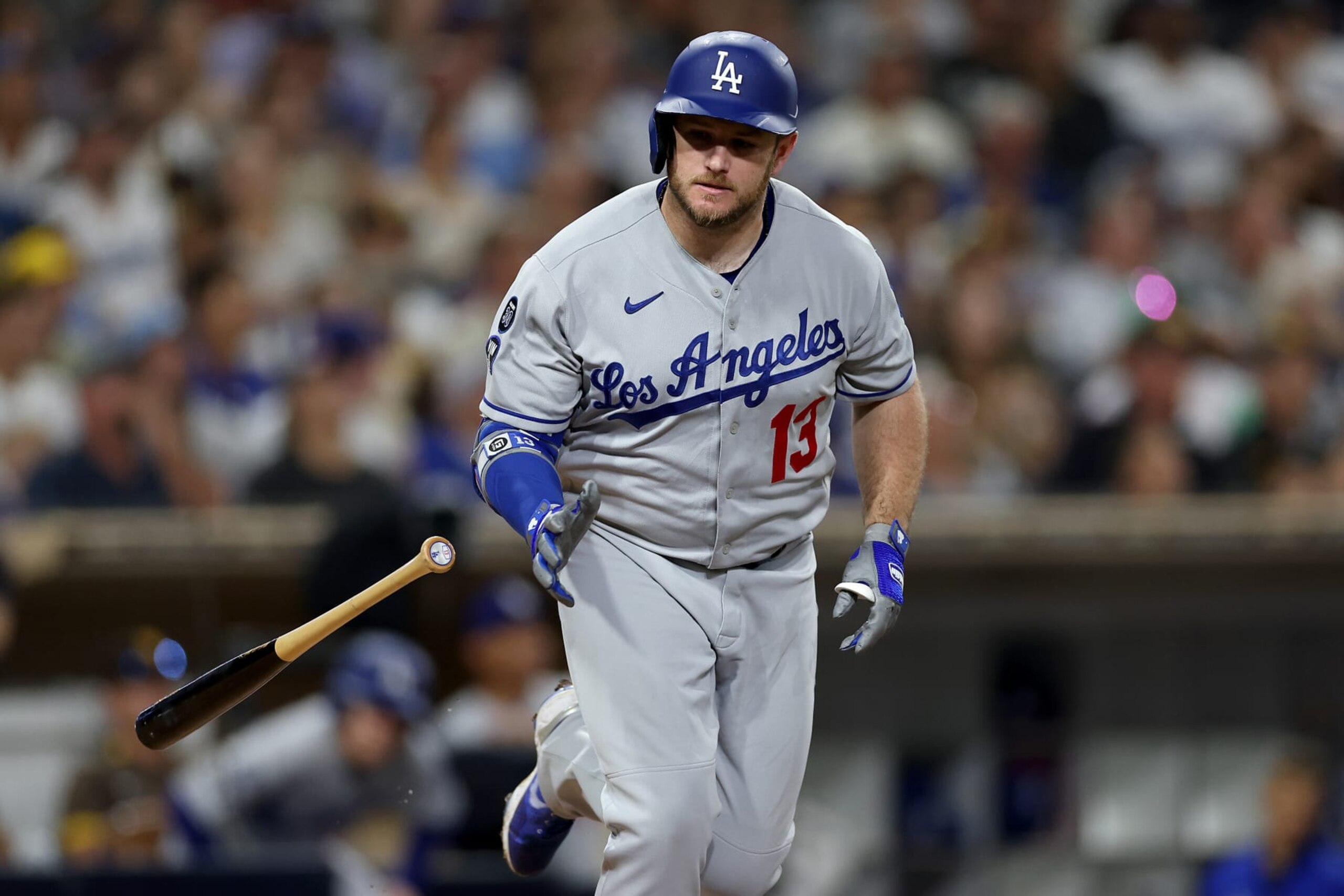 SAN DIEGO, CALIFORNIA - SEPTEMBER 27: Max Muncy #13 of the Los Angeles Dodgers flys out during the fourth inning of a game against the San Diego Padres at PETCO Park on September 27, 2022 in San Diego, California. (Photo by Sean M. Haffey/Getty Images)