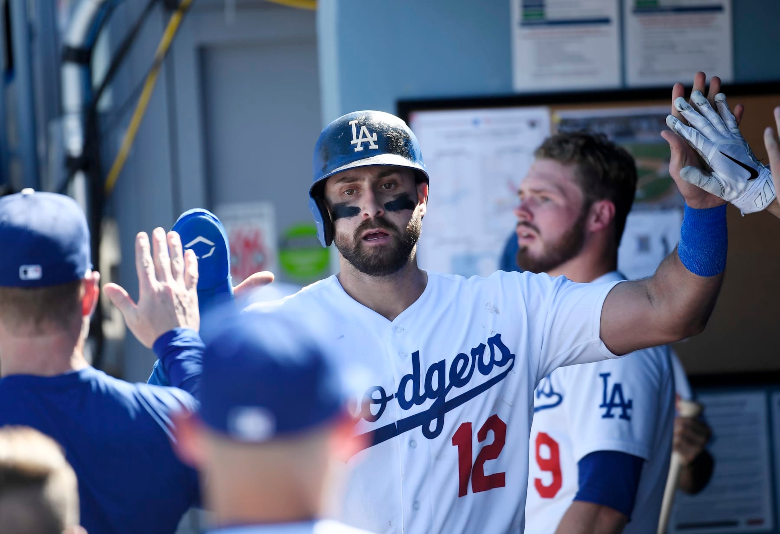 LOS ANGELES, CA - SEPTEMBER 25: Joey Gallo #12 of the Los Angeles Dodgers is congratulated after scoring a run against the St. Louis Cardinals during the third inning at Dodger Stadium on September 25, 2022 in Los Angeles, California. (Photo by Kevork Djansezian/Getty Images)