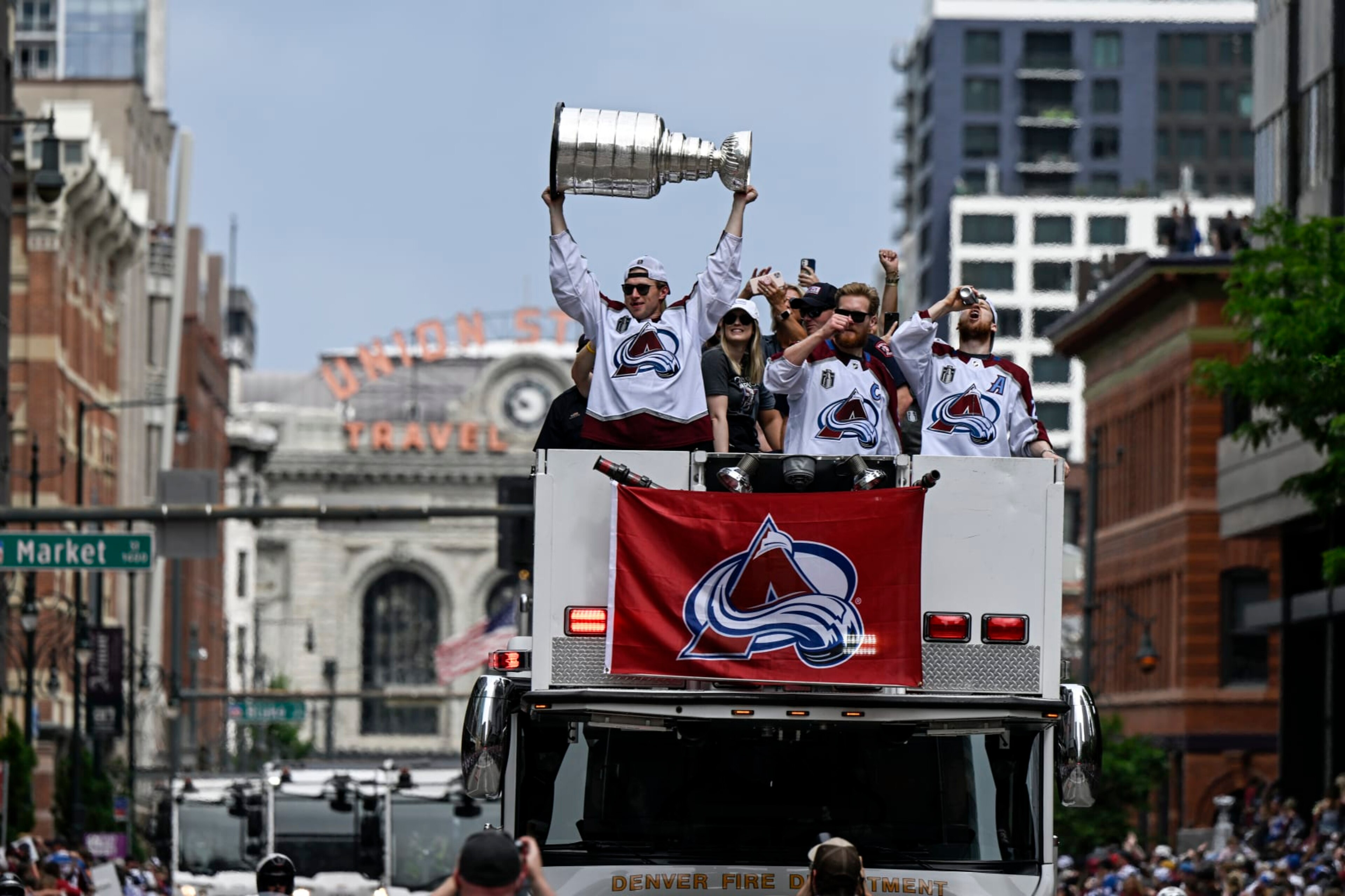 DENVER, CO - JUNE 30: Erik Johnson (6) hoists the cup as he parties alongside Nathan MacKinnon (29) and Gabriel Landeskog (92) during the Colorado Avalanche Stanley Cup celebration parade in downtown Denver on Thursday, June 30, 2022. (Photo by AAron Ontiveroz/The Denver Post) DENVER, CO - JUNE 30: Erik Johnson (6) hoists the cup as he parties alongside Nathan MacKinnon (29) and Gabriel Landeskog (92) during the Colorado Avalanche Stanley Cup celebration parade in downtown Denver on Thursday, June 30, 2022. (Photo by AAron Ontiveroz/The Denver Post)
