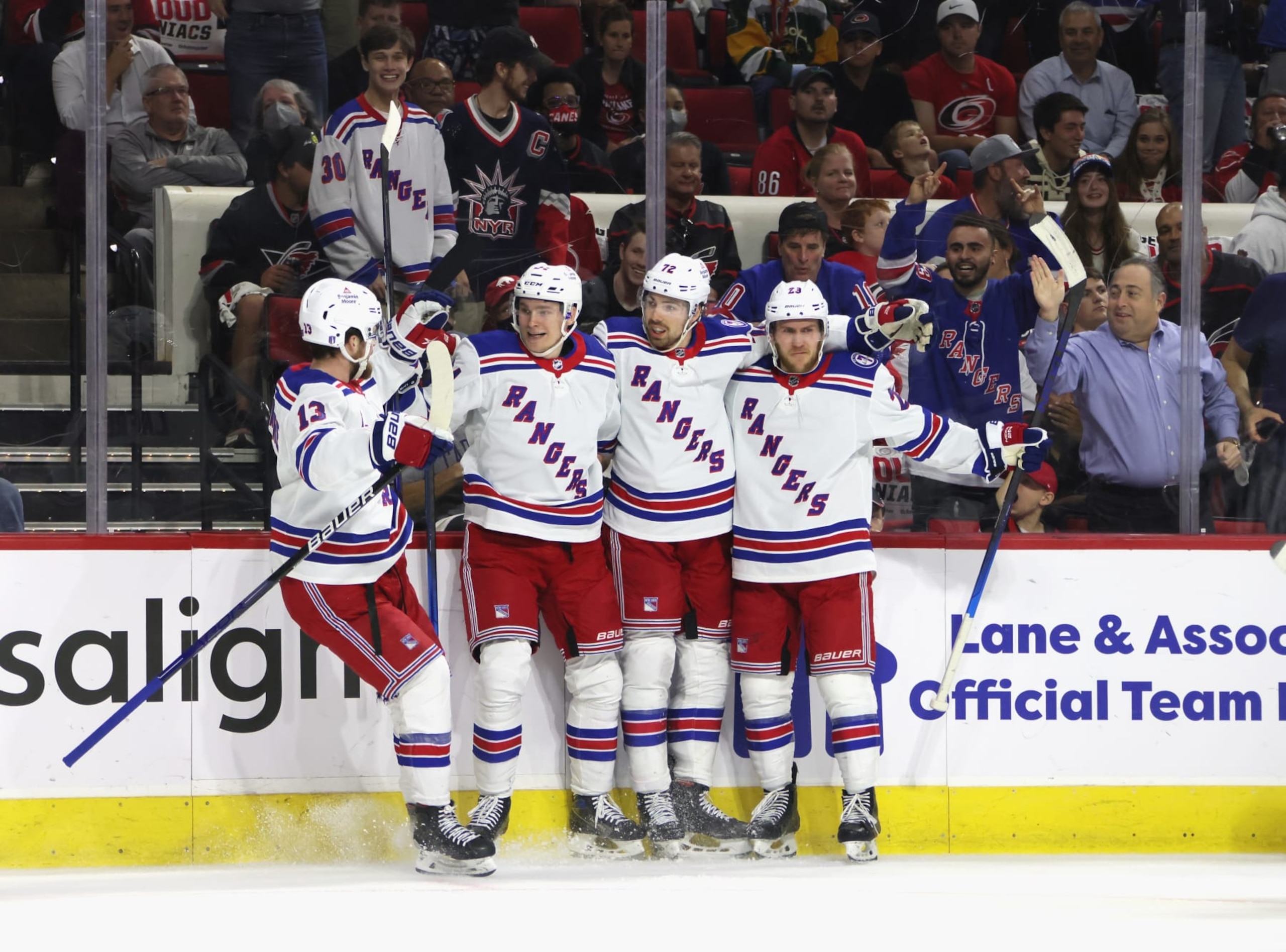 RALEIGH, NORTH CAROLINA - MAY 18: Filip Chytil #72 of the New York Rangers (2nd from right) celebrates his goal against the Carolina Hurricanes at 7:07 of the first period and is joined by (L-R) Alexis Lafreniere #13, Kaapo Kakko #24 and Adam Fox #23 in Game One of the Second Round of the 2022 Stanley Cup Playoffs at PNC Arena on May 18, 2022 in Raleigh, North Carolina. (Photo by Bruce Bennett/Getty Images) RALEIGH, NORTH CAROLINA - MAY 18: Filip Chytil #72 of the New York Rangers (2nd from right) celebrates his goal against the Carolina Hurricanes at 7:07 of the first period and is joined by (L-R) Alexis Lafreniere #13, Kaapo Kakko #24 and Adam Fox #23 in Game One of the Second Round of the 2022 Stanley Cup Playoffs at PNC Arena on May 18, 2022 in Raleigh, North Carolina. (Photo by Bruce Bennett/Getty Images)