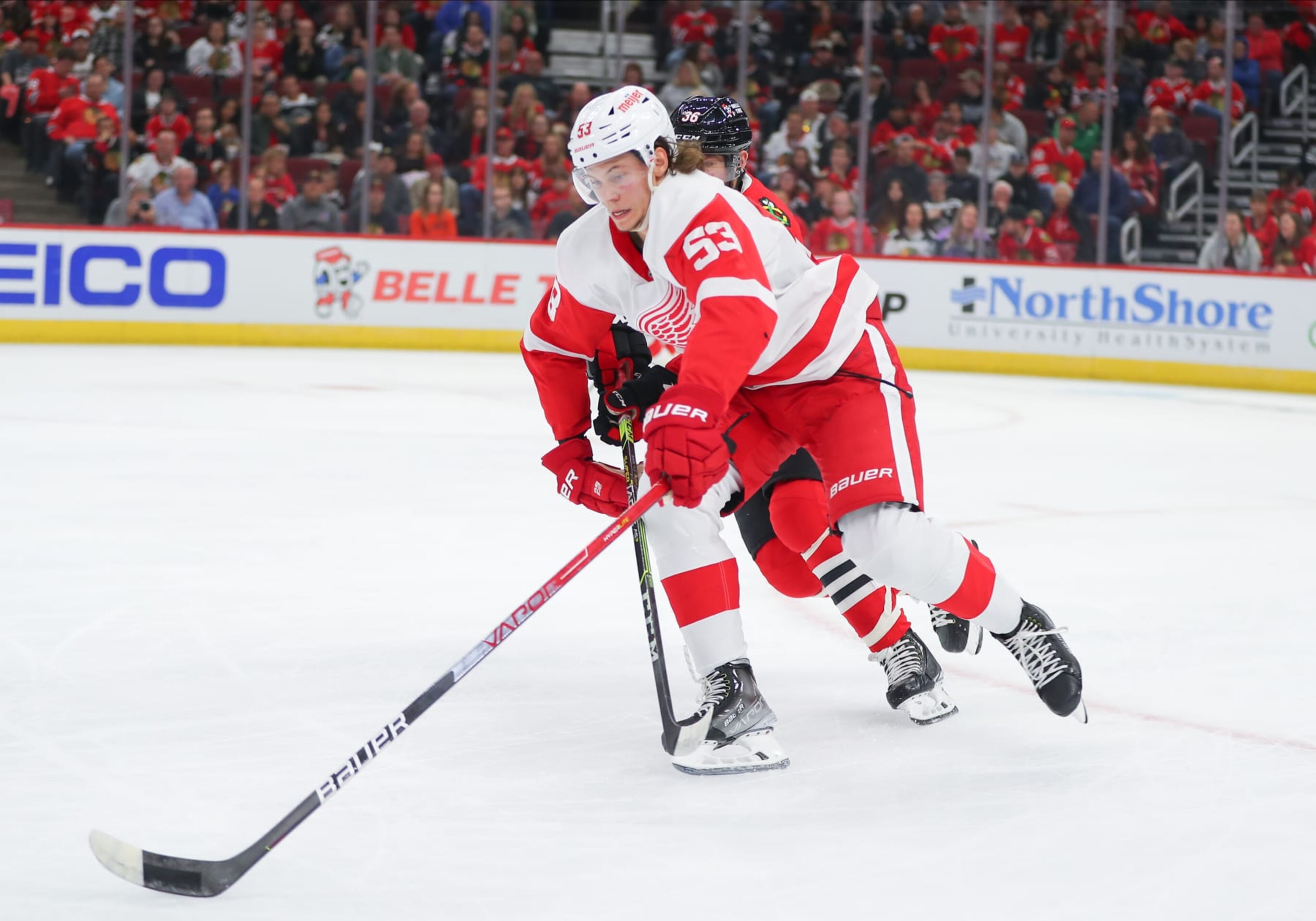CHICAGO, IL - OCTOBER 01: Detroit Red Wings defenseman Moritz Seider (53) skates with the puck in action during a game between the Detroit Red Wings and the Chicago Blackhawks on October 1, 2022 at the United Center in Chicago, IL. (Photo by Melissa Tamez/Icon Sportswire via Getty Images) CHICAGO, IL - OCTOBER 01: Detroit Red Wings defenseman Moritz Seider (53) skates with the puck in action during a game between the Detroit Red Wings and the Chicago Blackhawks on October 1, 2022 at the United Center in Chicago, IL. (Photo by Melissa Tamez/Icon Sportswire via Getty Images)